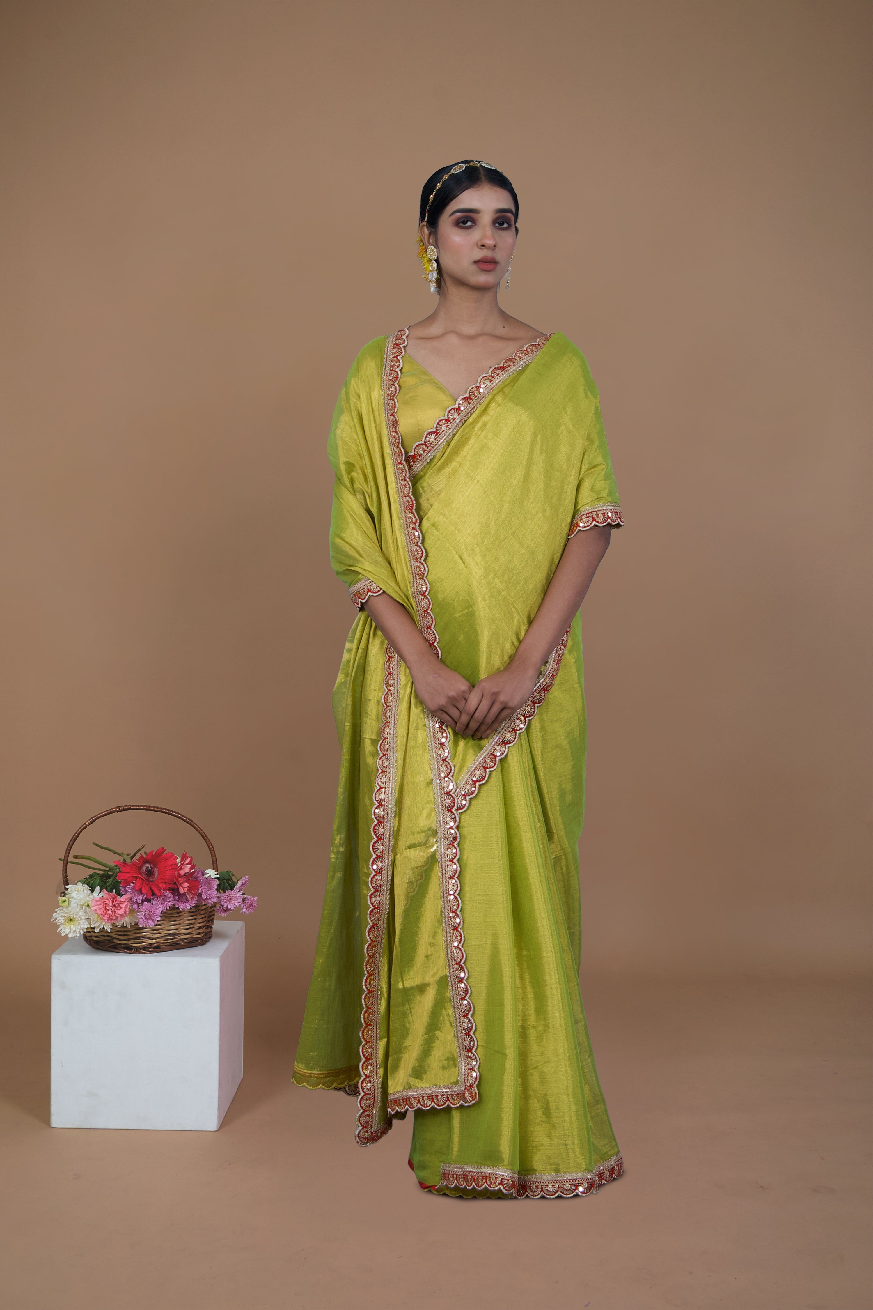 Nirali I Neon green handwoven tissue saree with scalloped lace