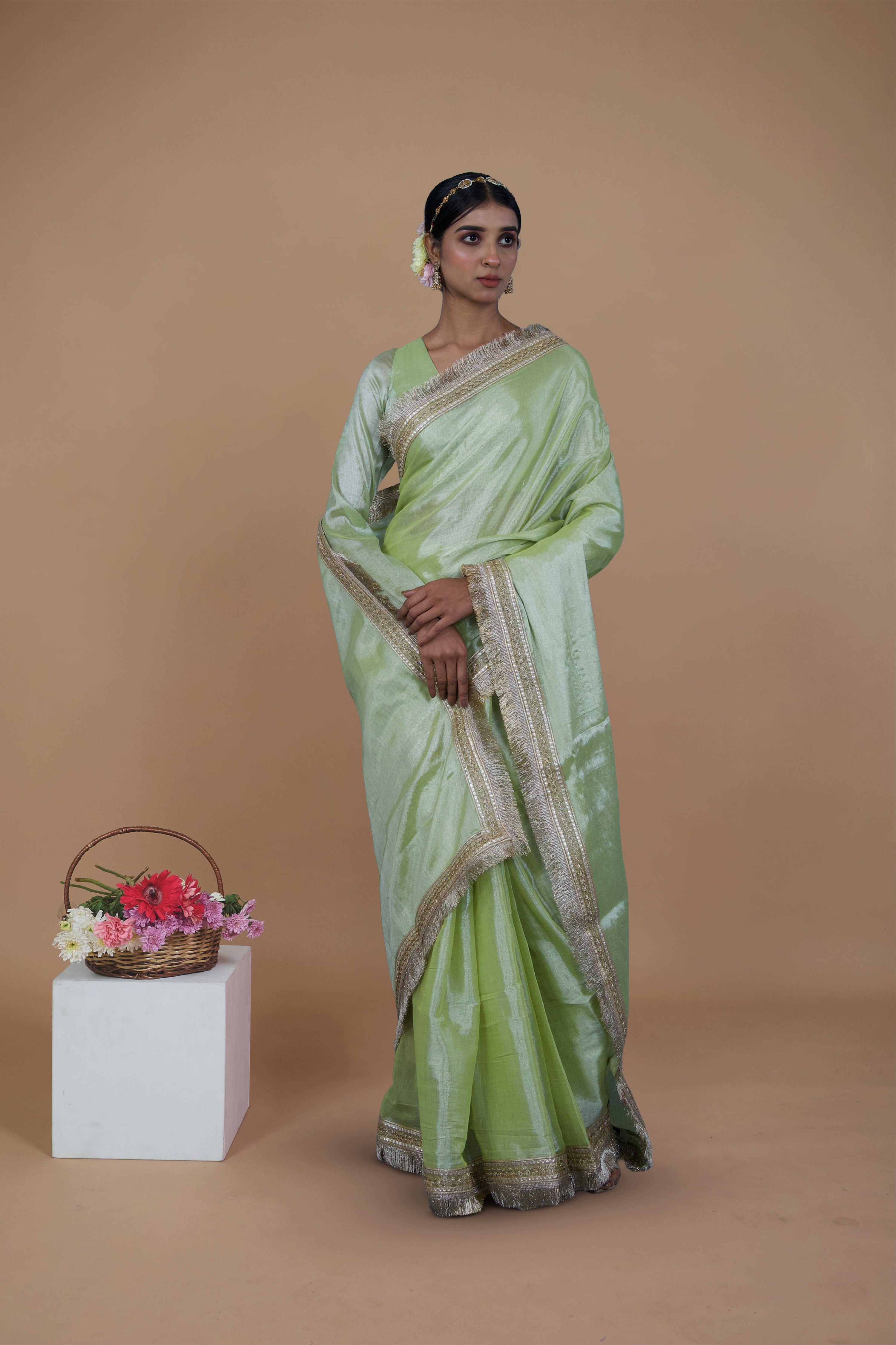 Mayukha I Neon Green handwoven tissue saree with matte gold lace