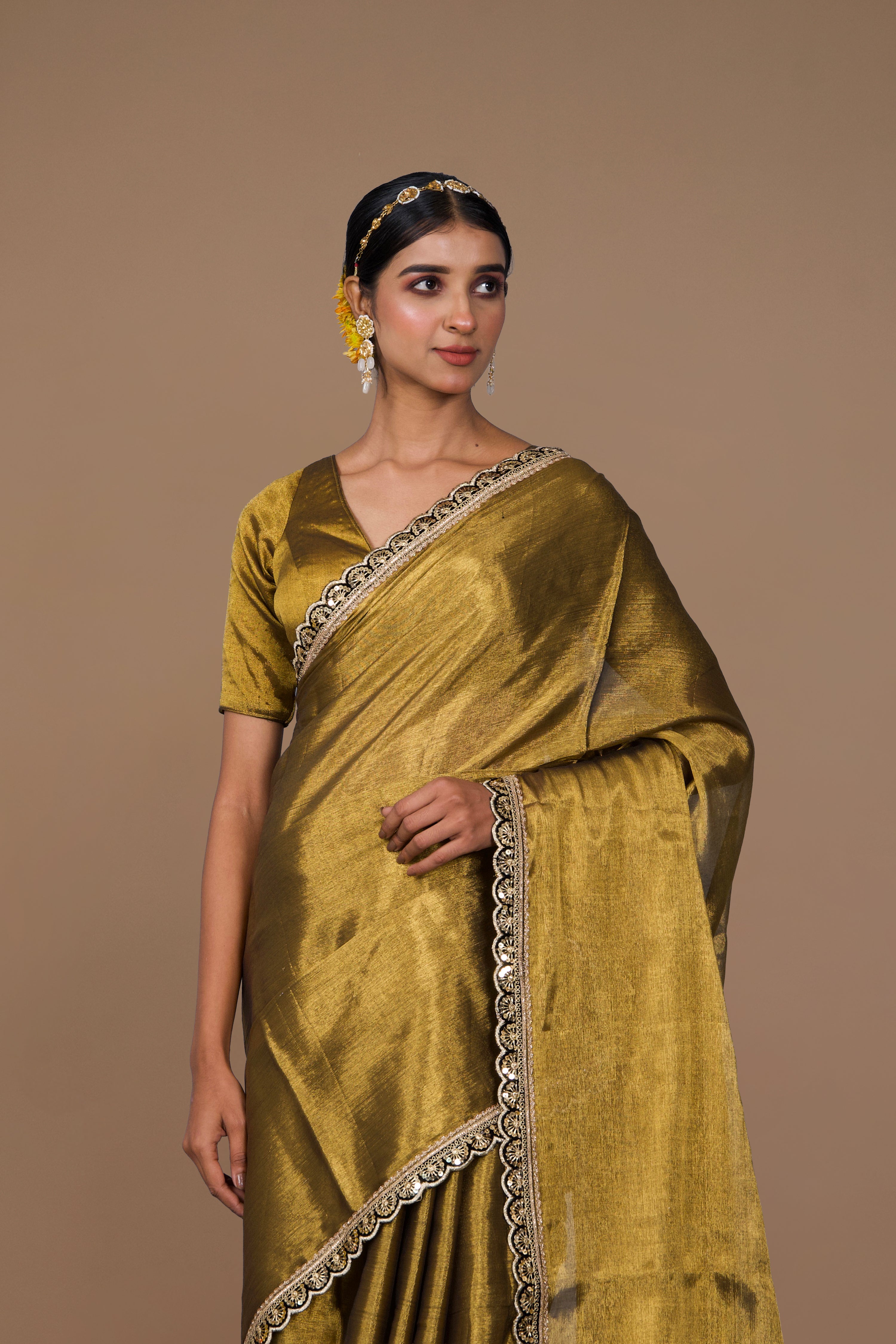 Swarangi I Golden handwoven tissue saree with black scalloped lace
