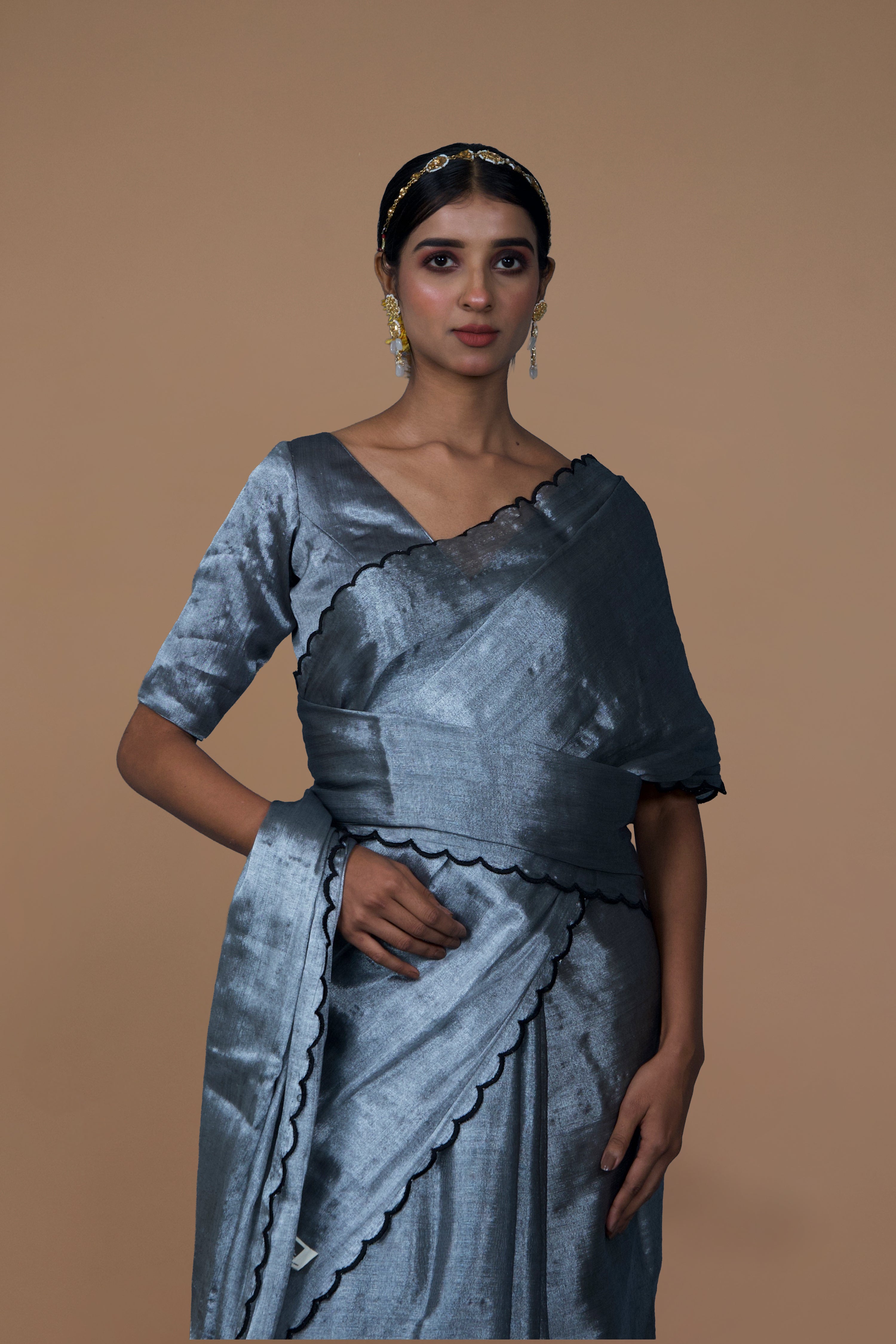 Dhruvi I Silver handwoven tissue saree with scalloped pallu and border