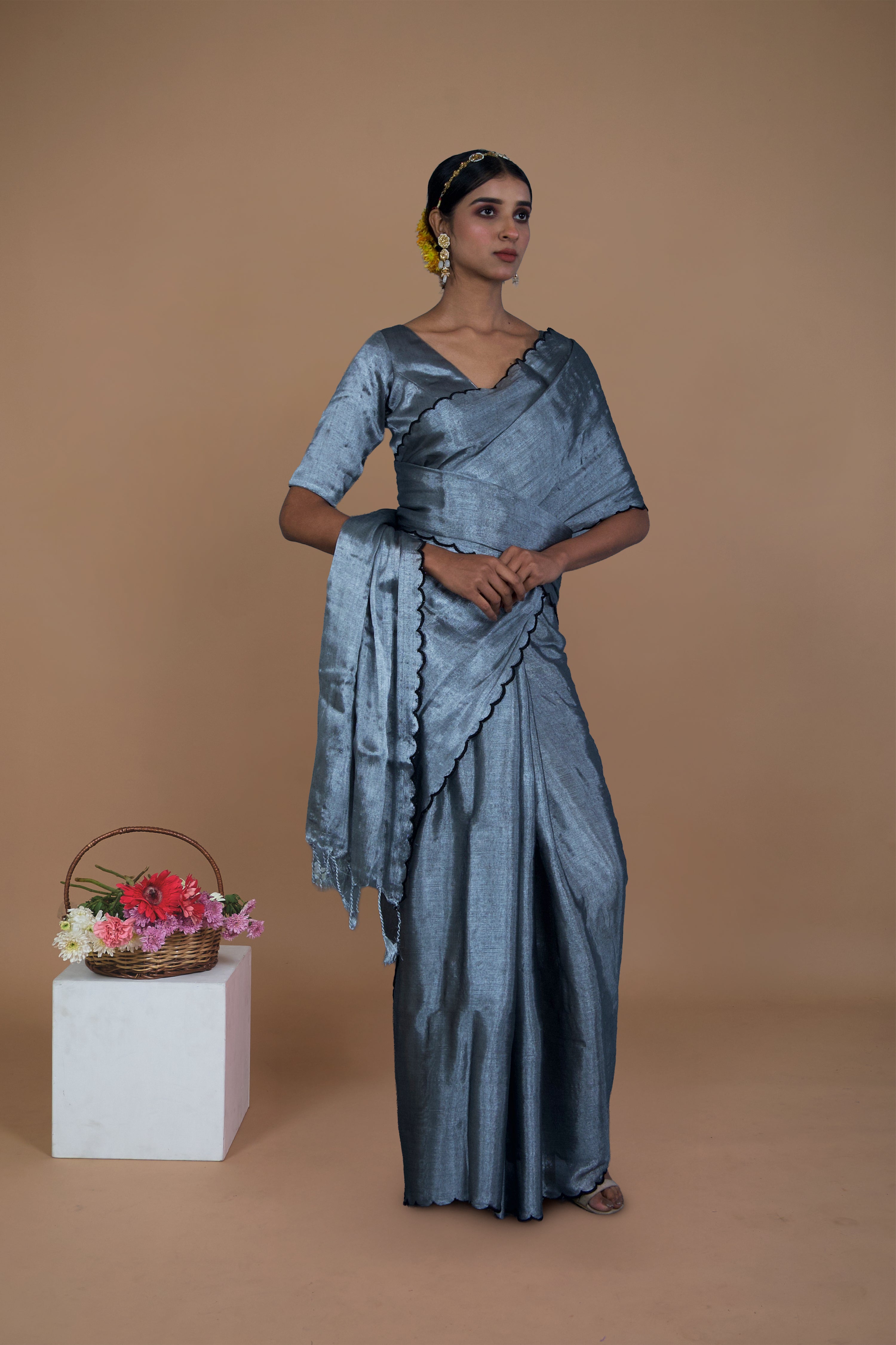Dhruvi I Silver handwoven tissue saree with scalloped pallu and border