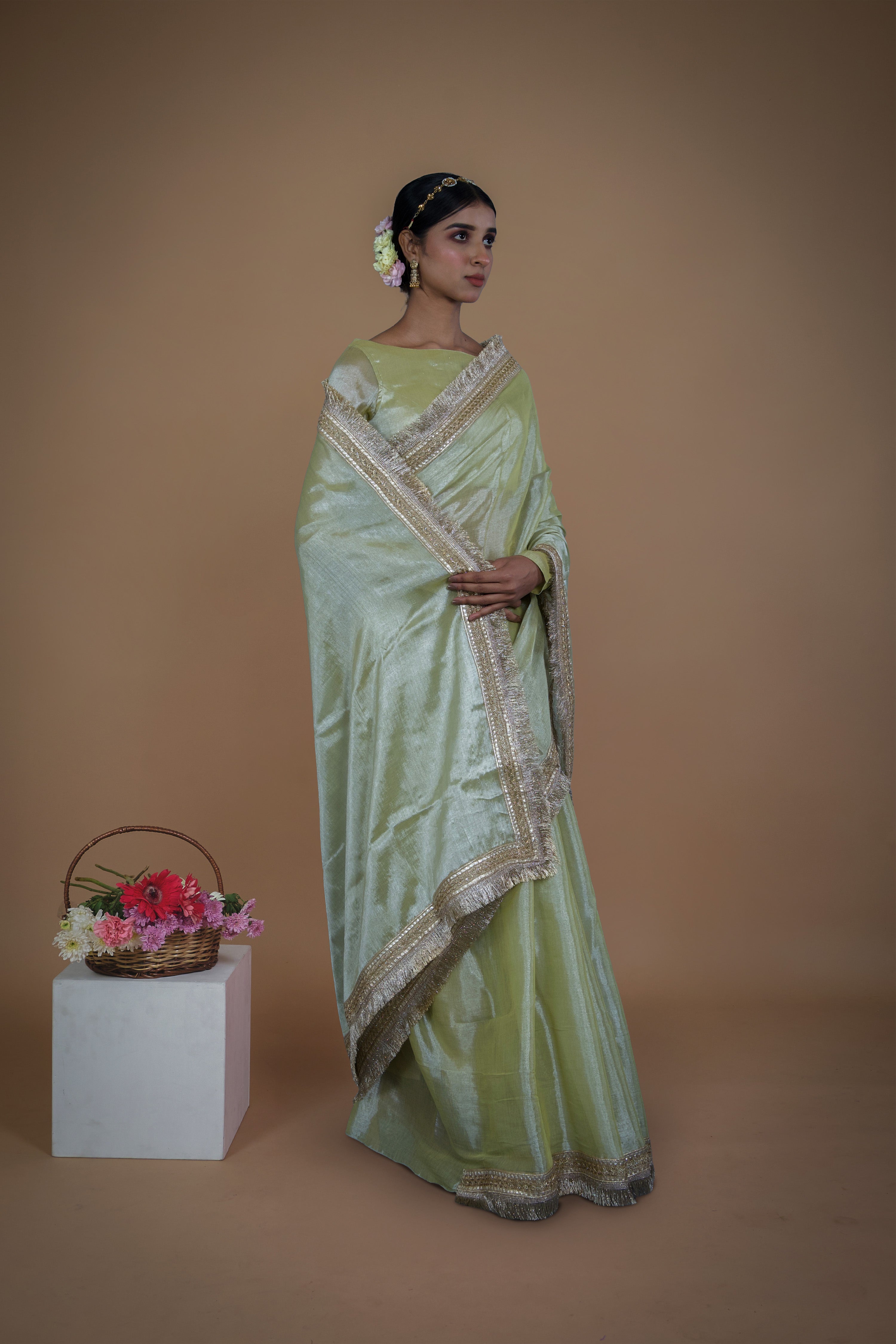 Sampada I Neon Olive handwoven tissue saree with matte gold lace