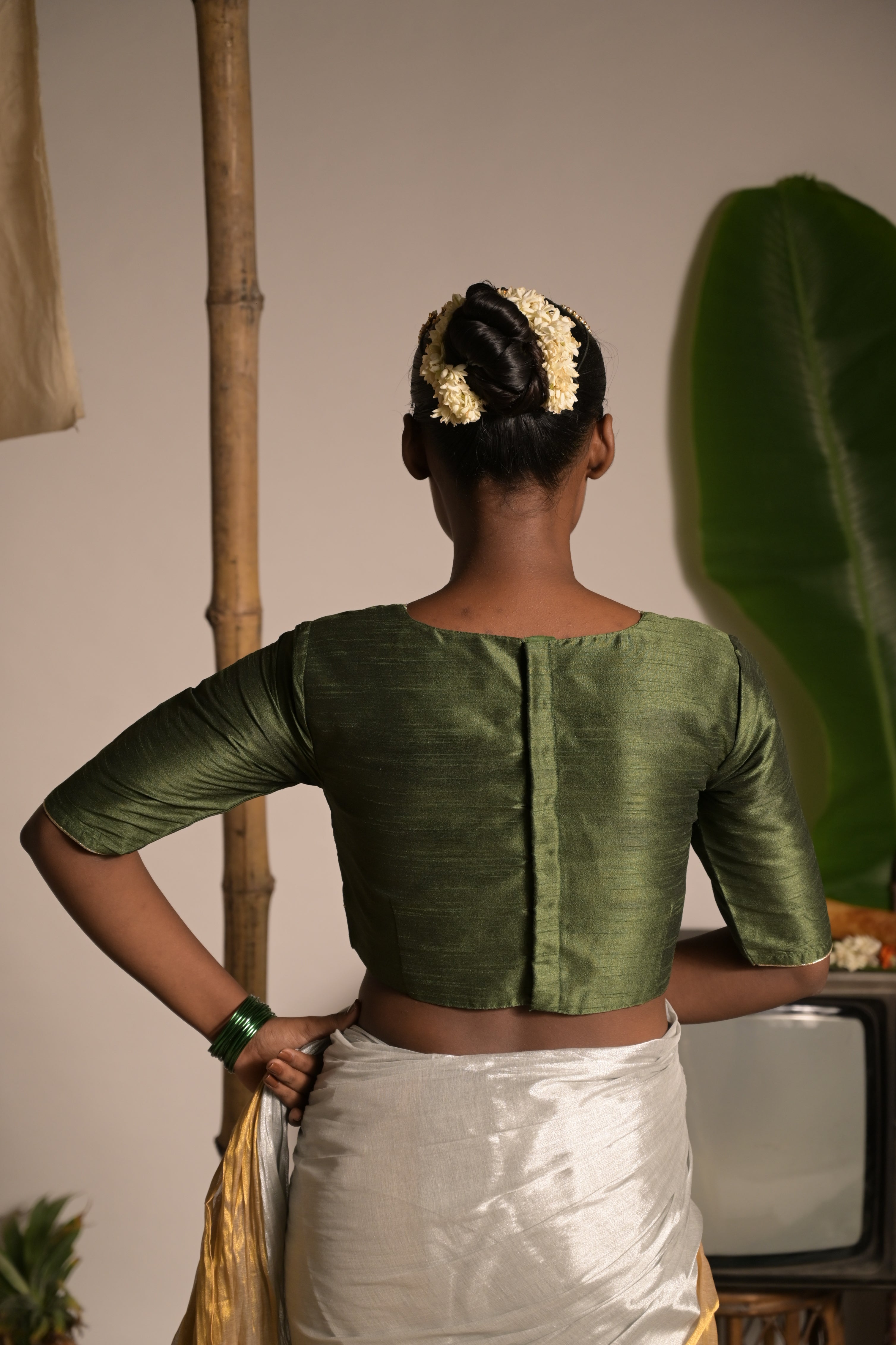 Somaangi I Green silk blouse with V neckline