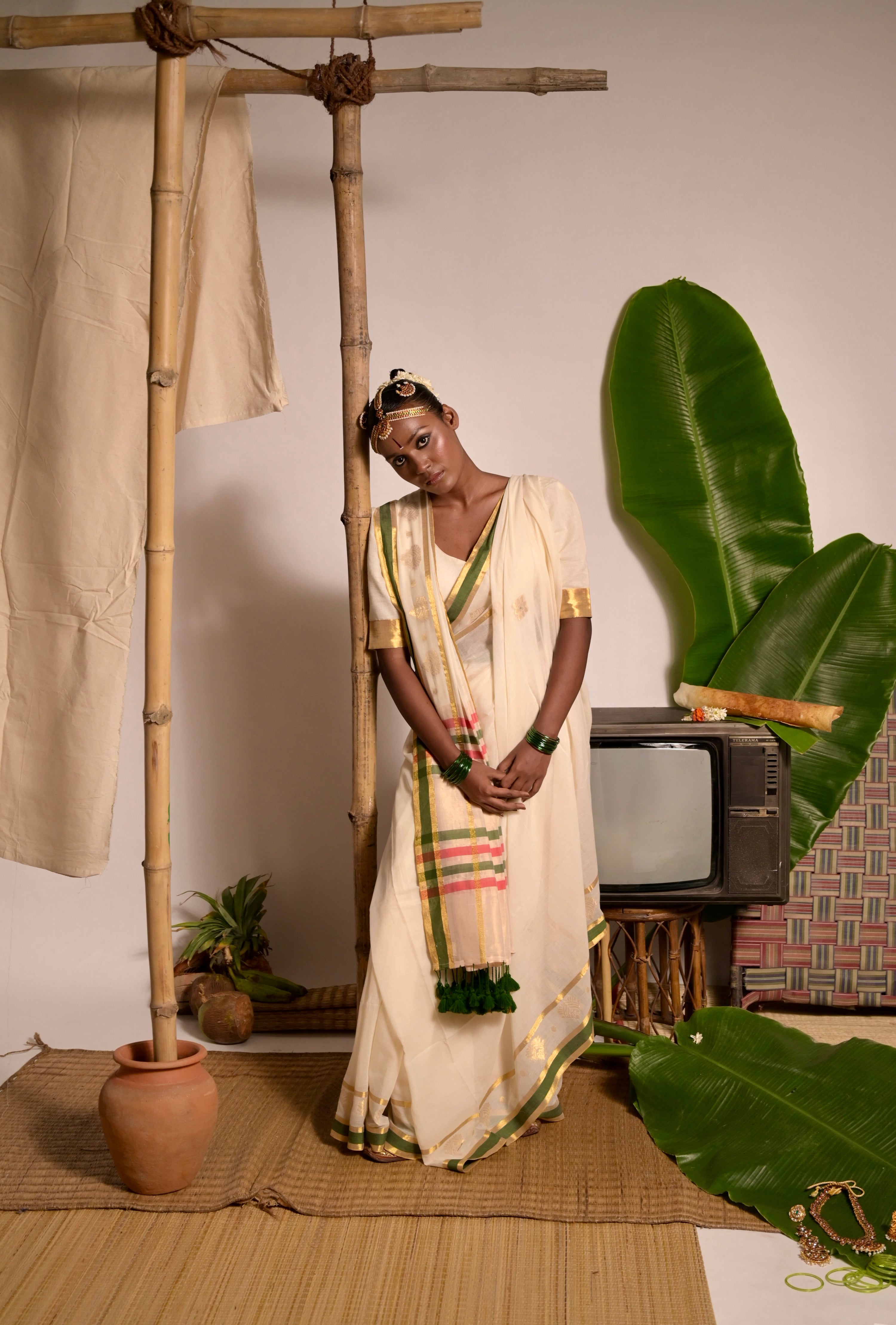 Kathakali I Off white handwoven mul cotton saree with green and zari border