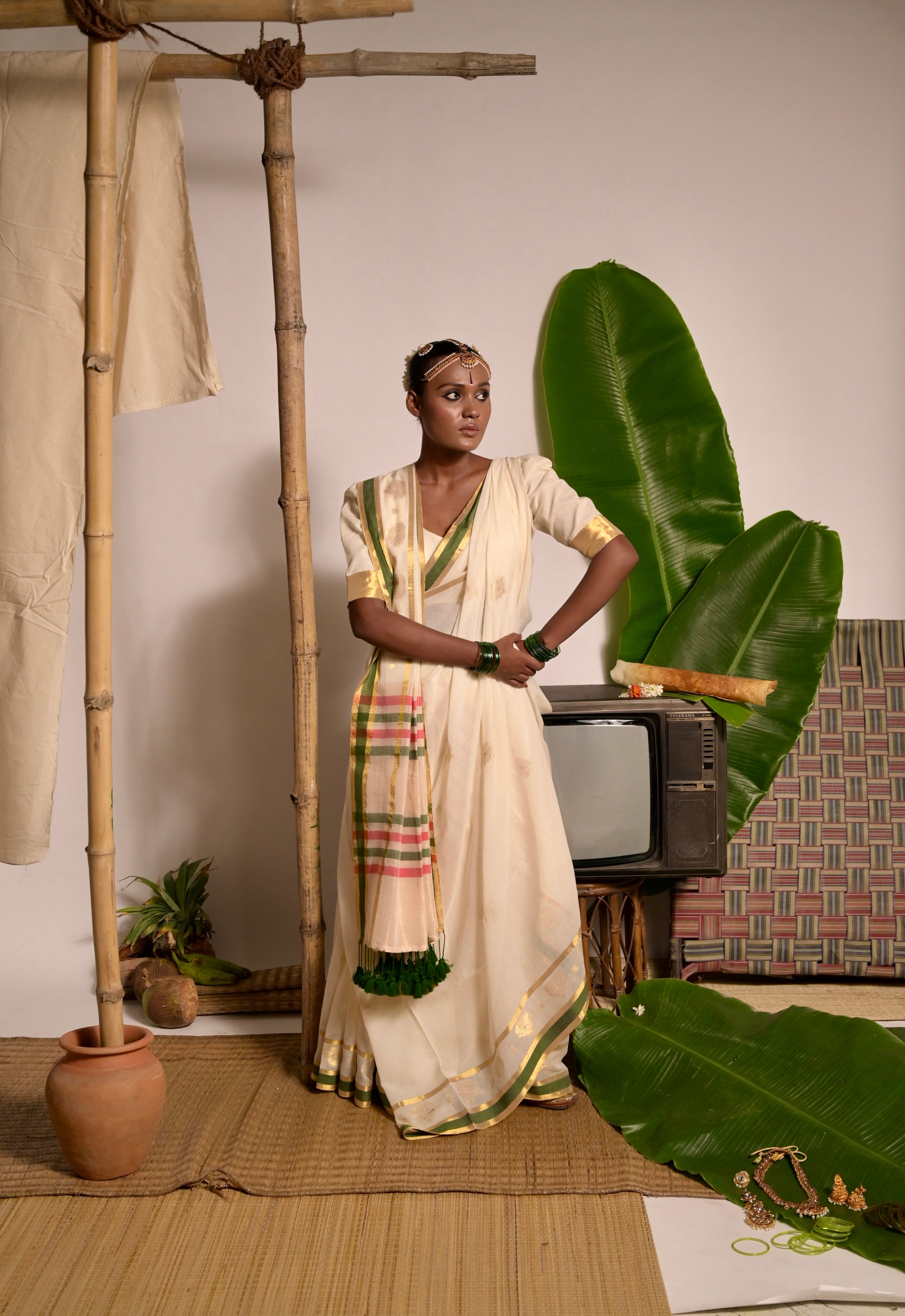 Kathakali I Off white handwoven mul cotton saree with green and zari border