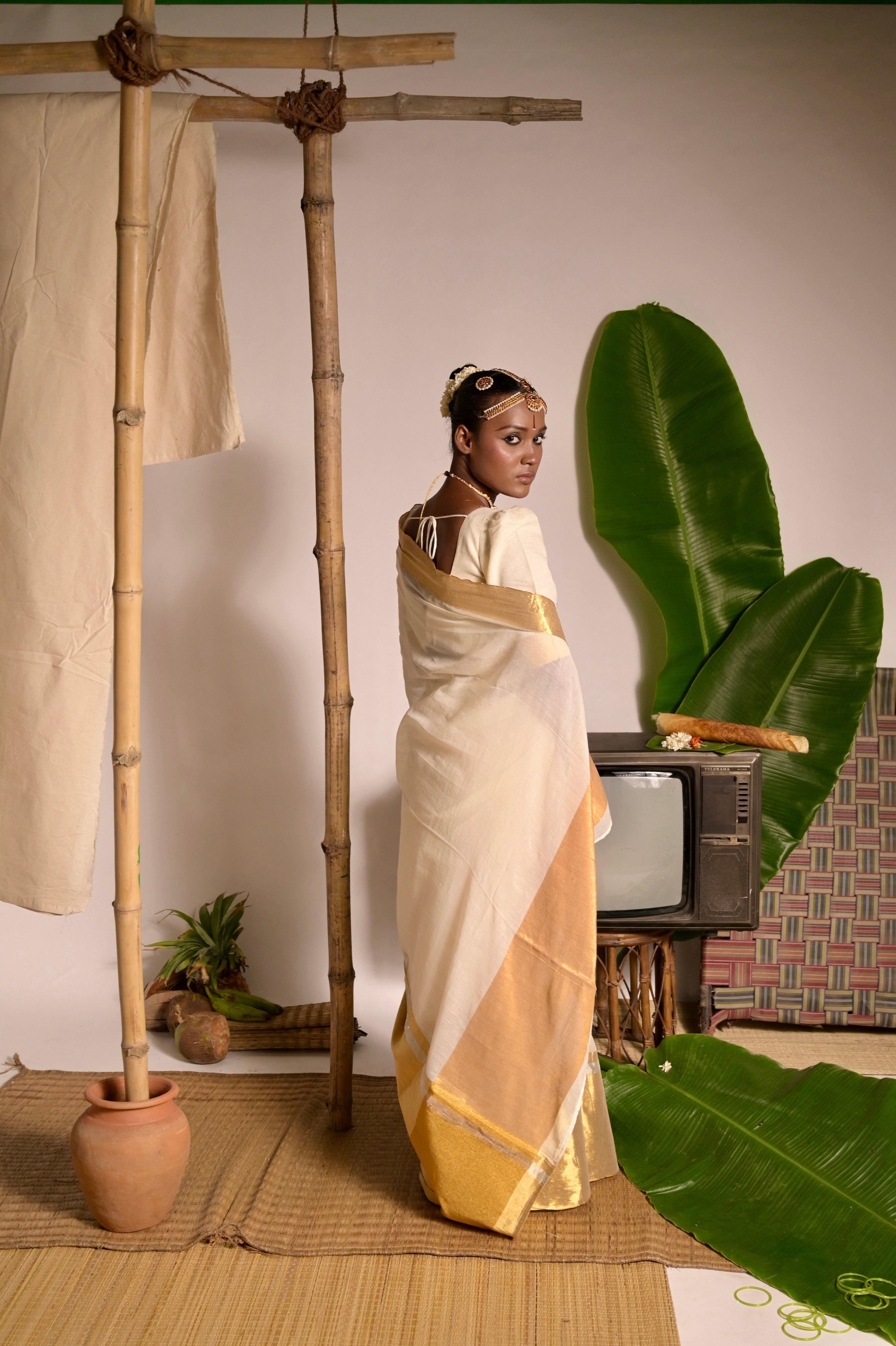 Swarnamaya I Off white mul cotton handwoven saree with golden border