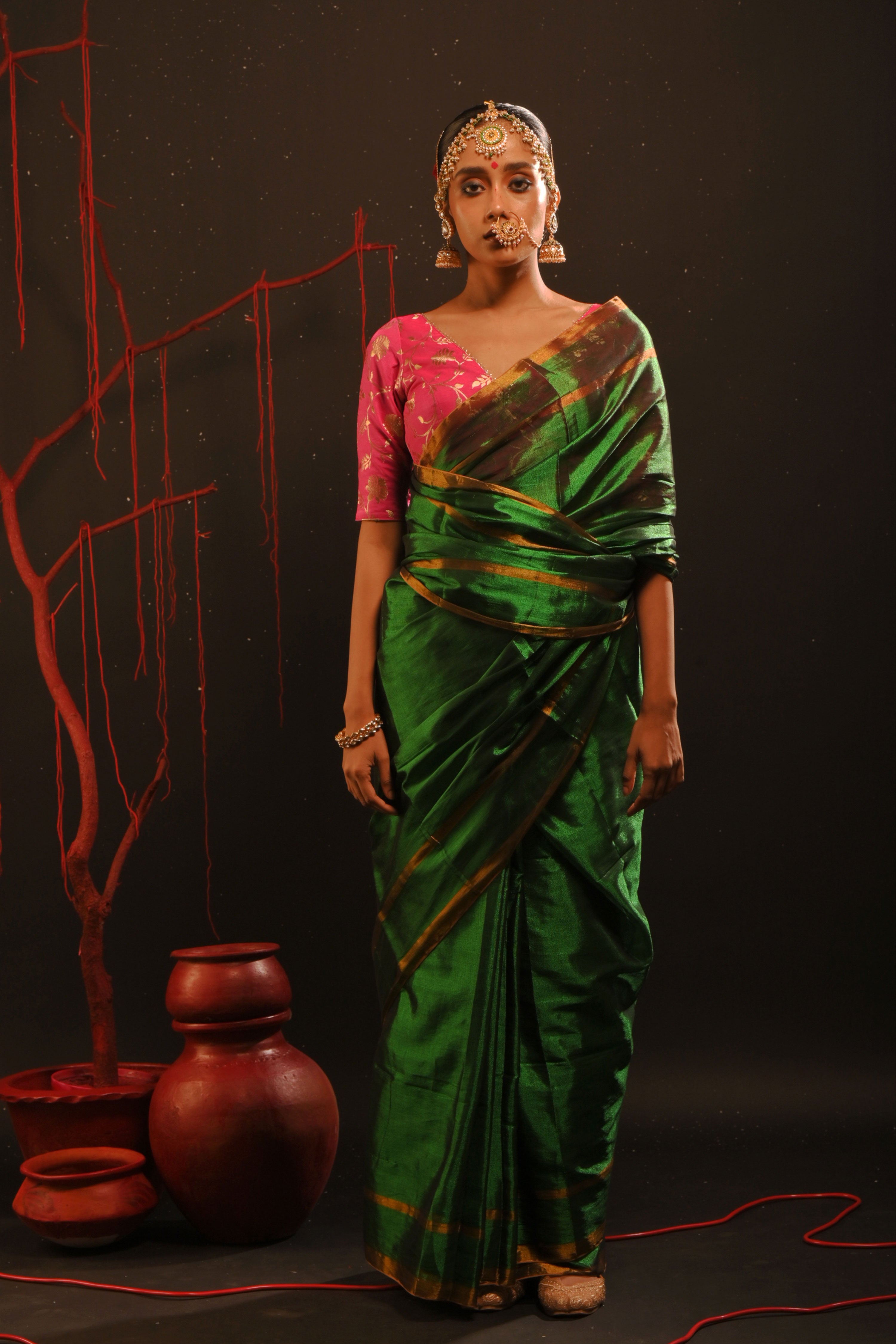 Chitrani I Green handwoven tissue saree with gold striped border