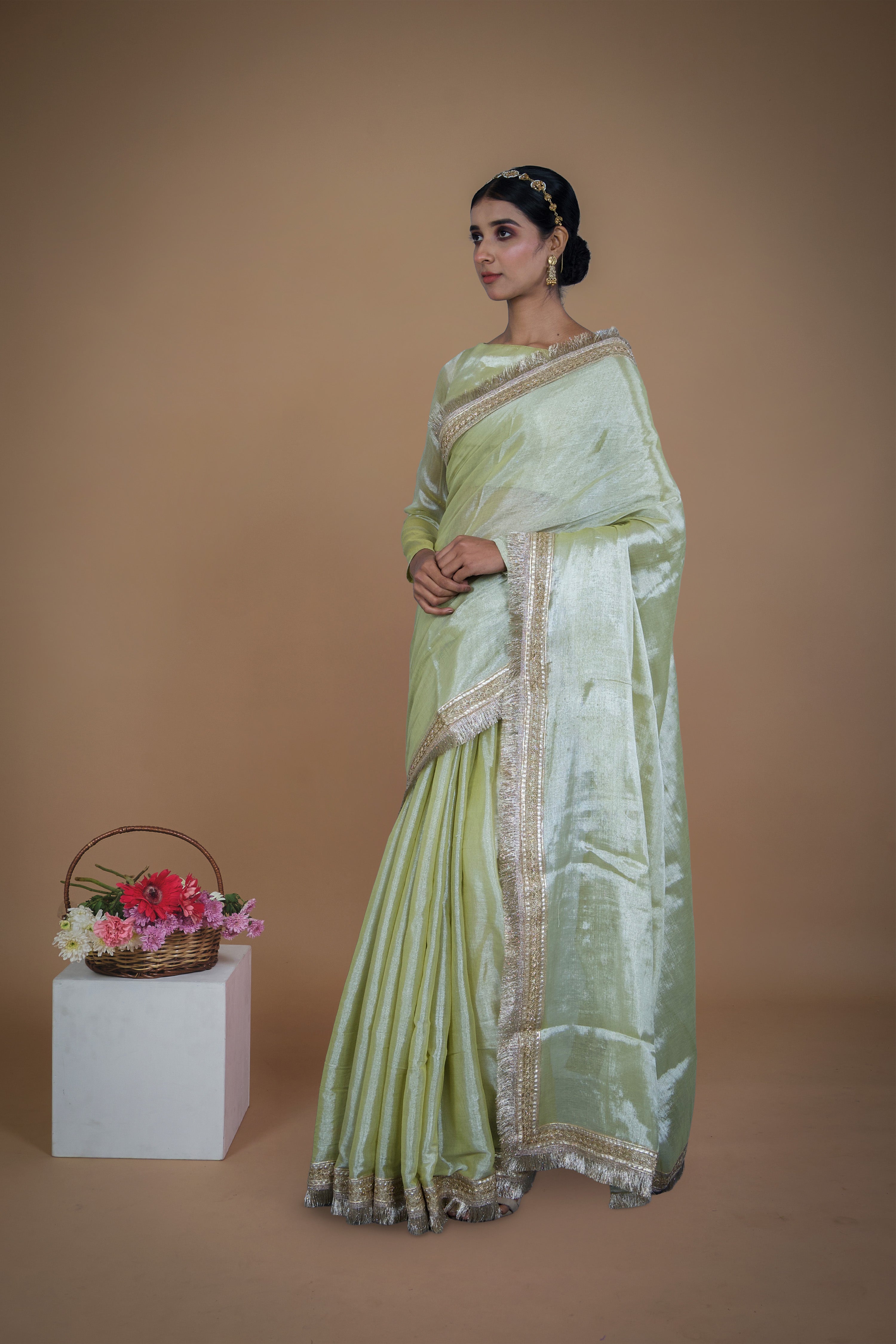 Sampada I Neon Olive handwoven tissue saree with matte gold lace