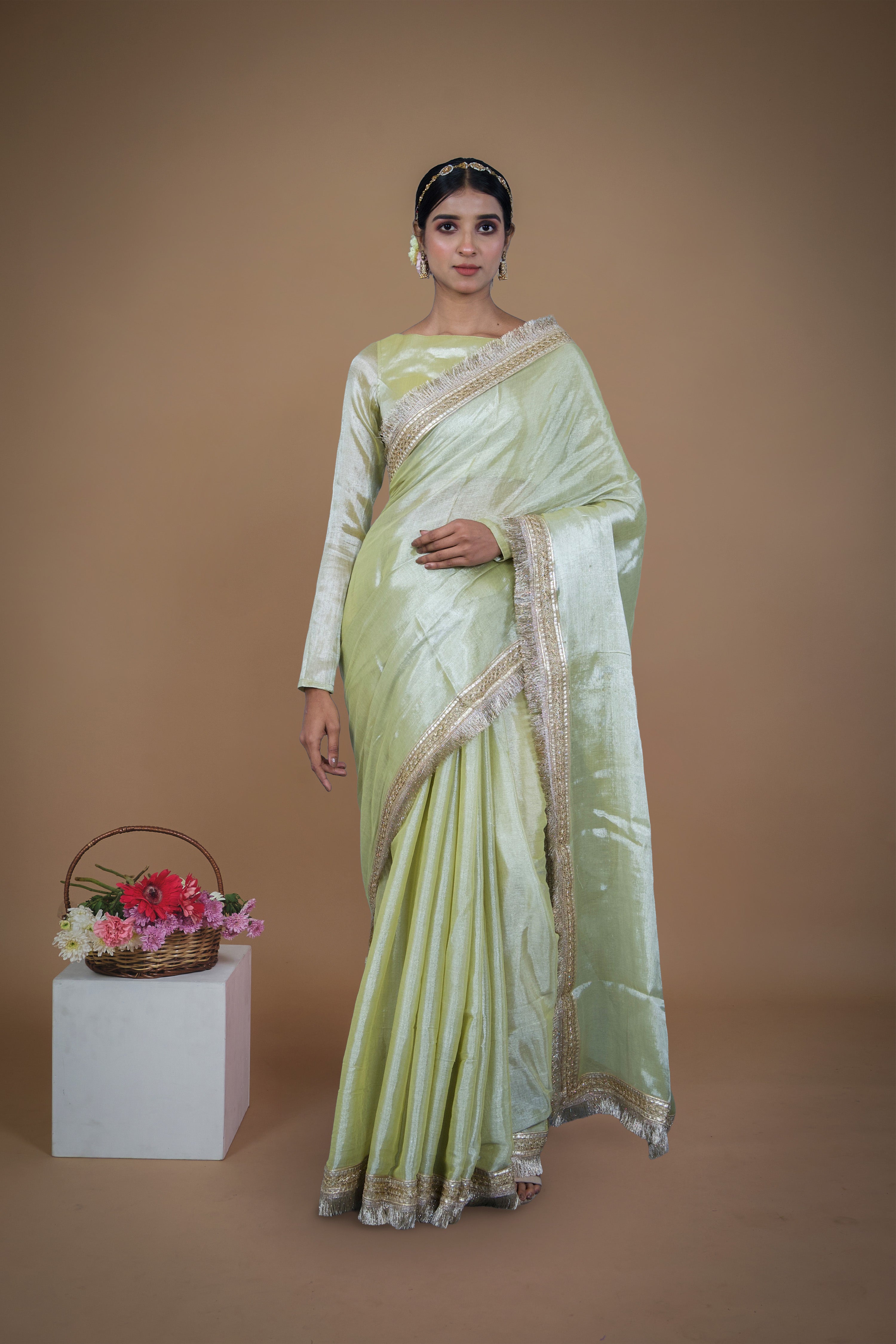 Sampada I Neon Olive handwoven tissue saree with matte gold lace