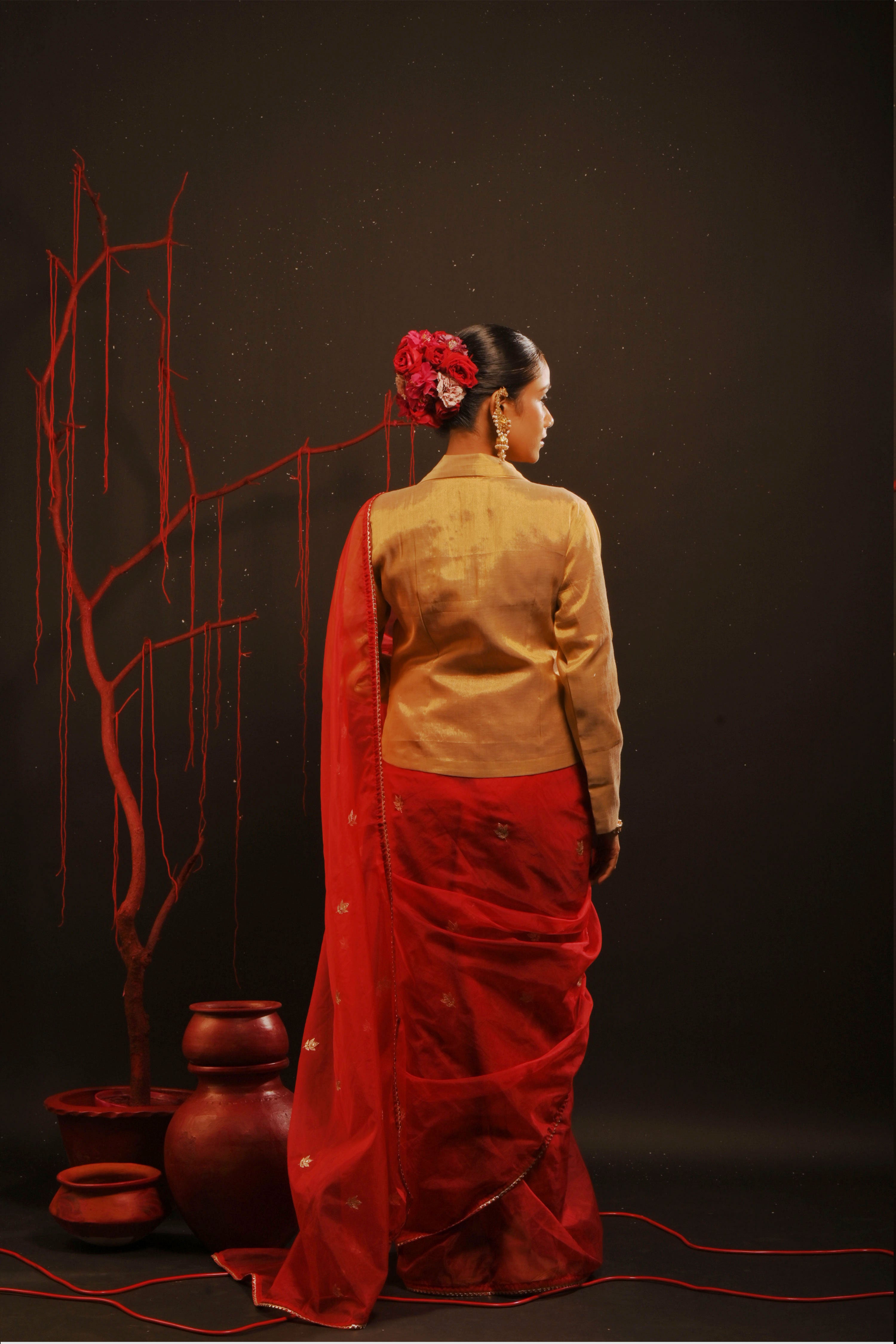 Mihira I Red organza saree paired with red chinon blouse and Tissue jacket