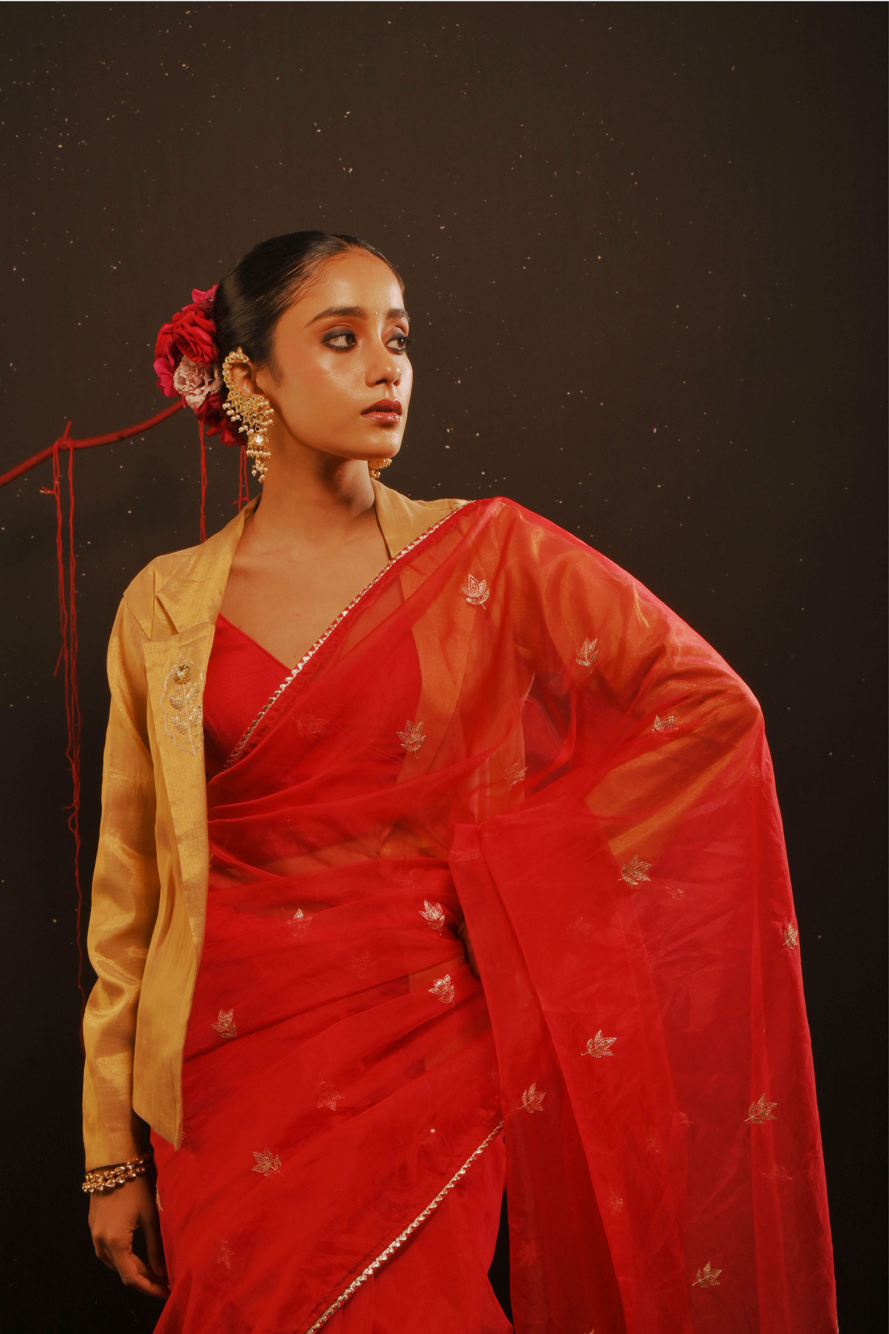 Mihira I Red organza saree paired with red chinon blouse and Tissue jacket