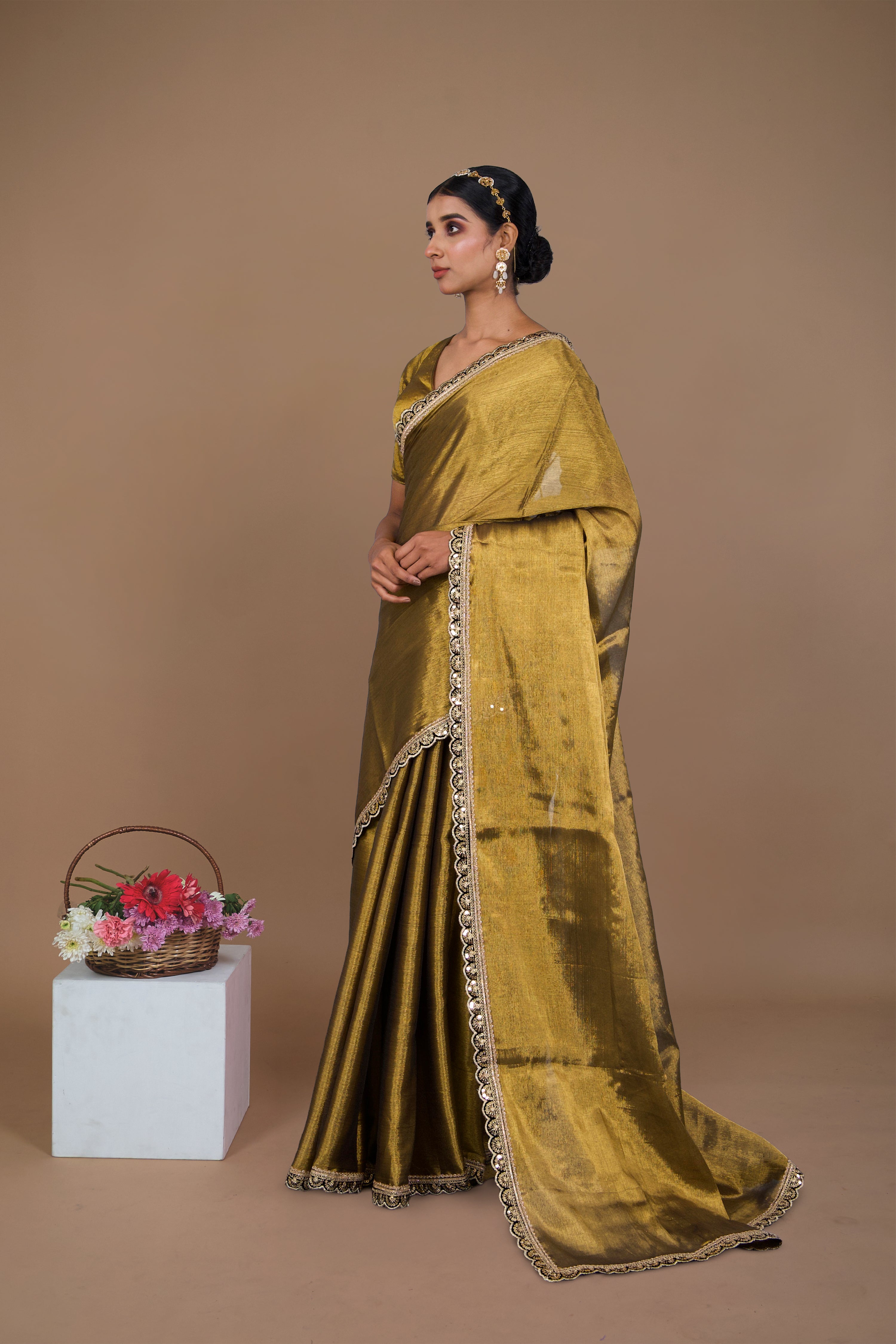 Swarangi I Golden handwoven tissue saree with black scalloped lace