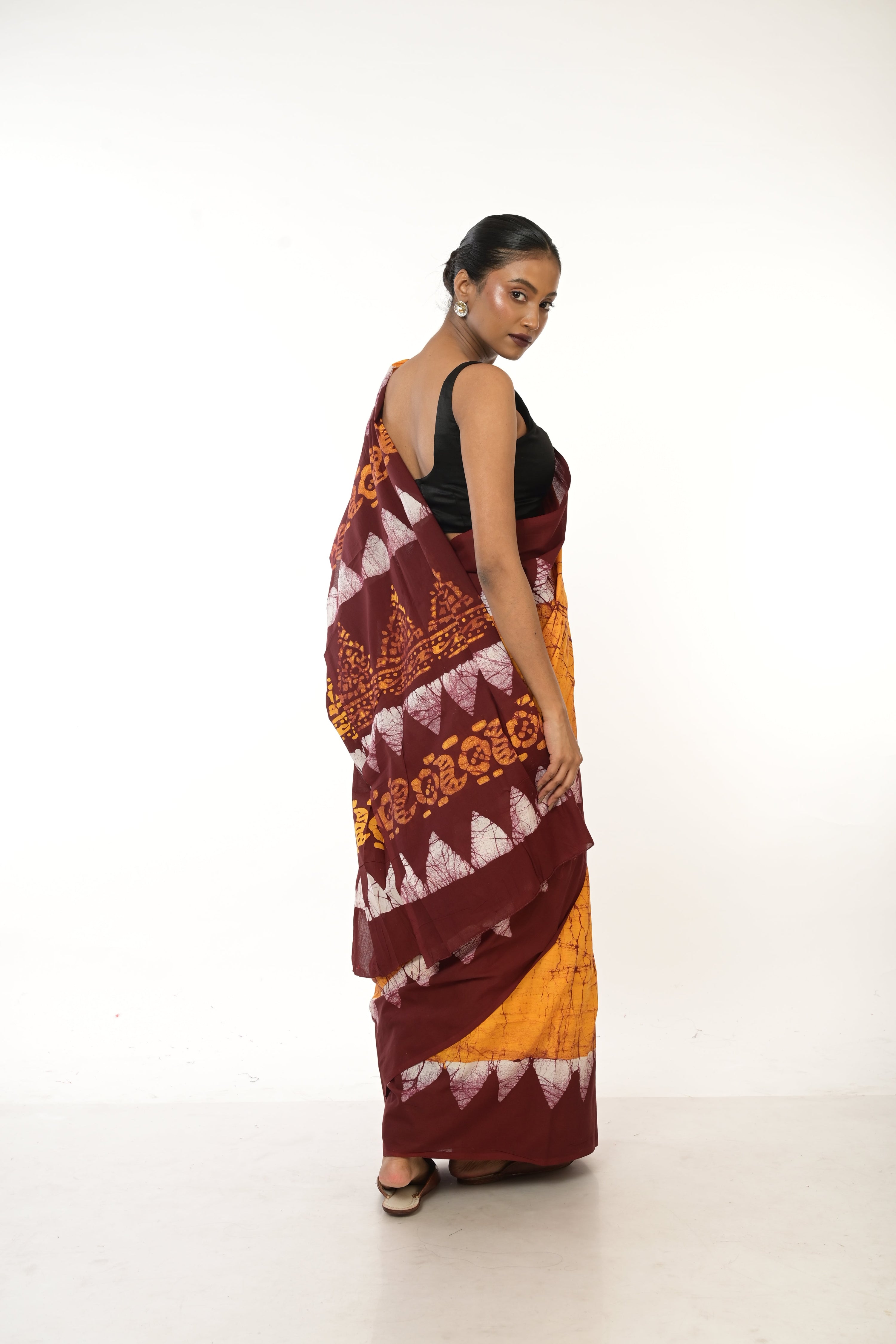 Dishani I Golden Yellow Handloom Batik Printed saree with maroon border