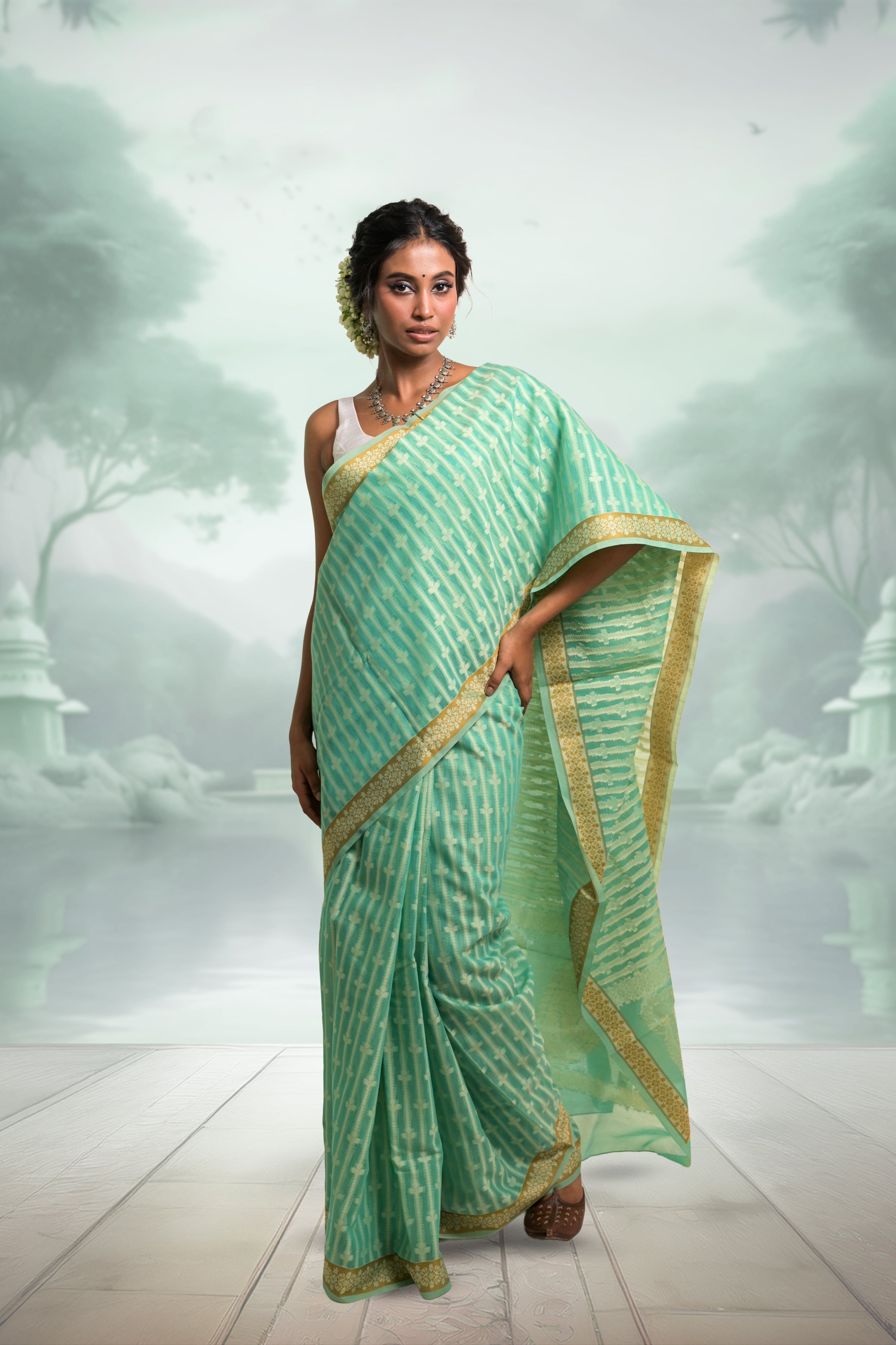 Amaaya I Sea Green Handloom Cotton Banarasi Saree with Floral Border and striped leave vines