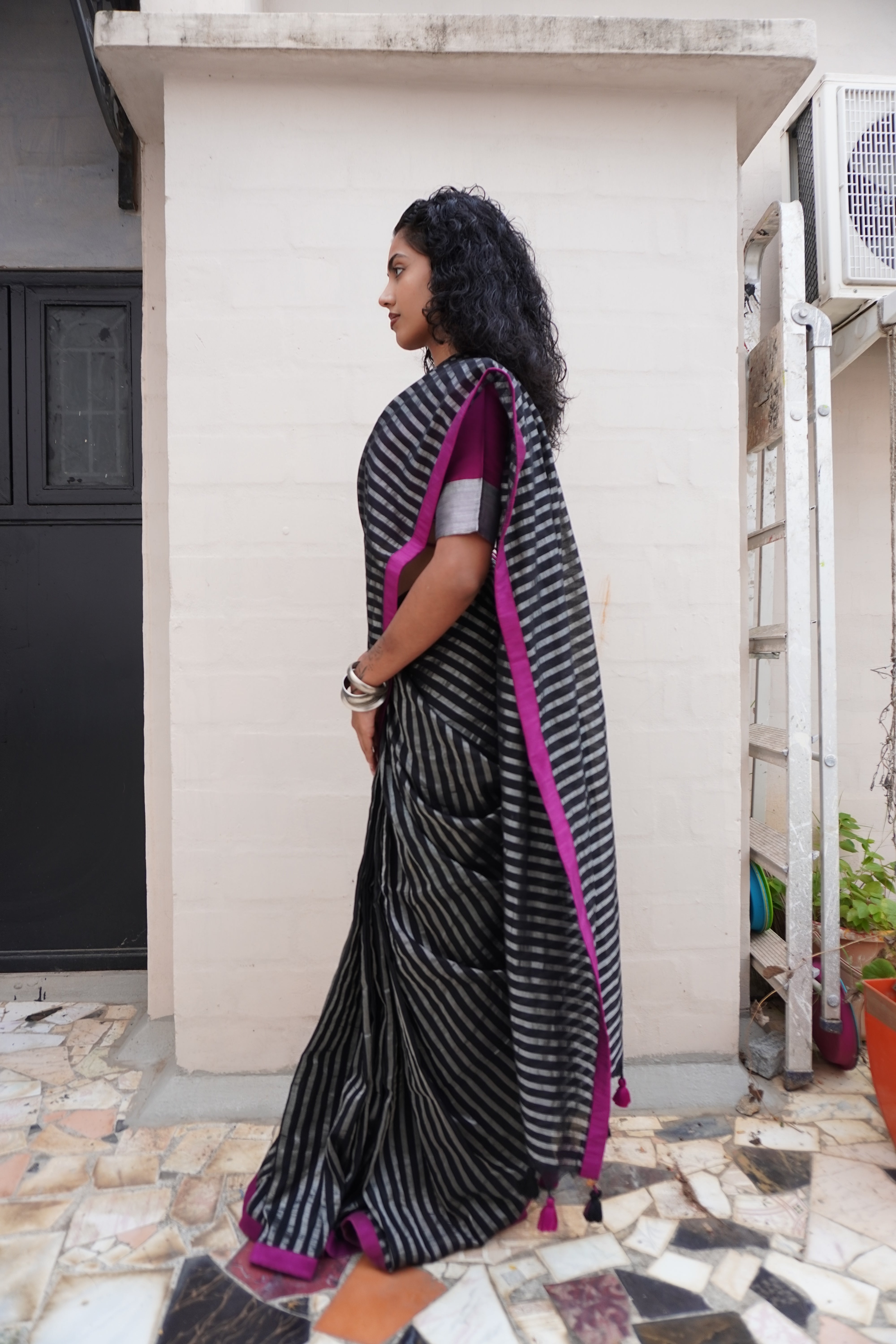 Secret Alchemy I Black Handloom Cotton Saree with zari stripes and Purple Border