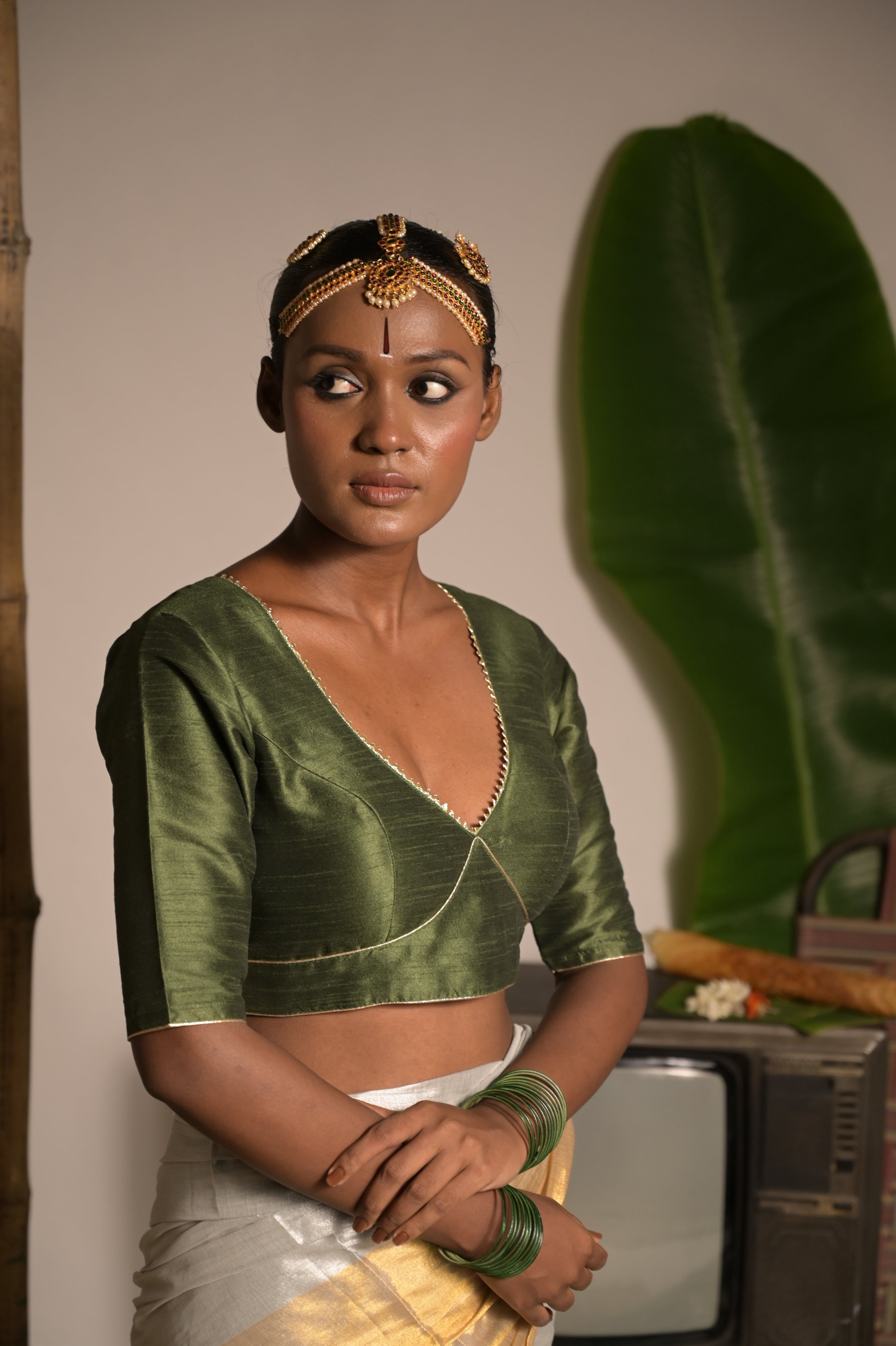 Somaangi I Green silk blouse with V neckline