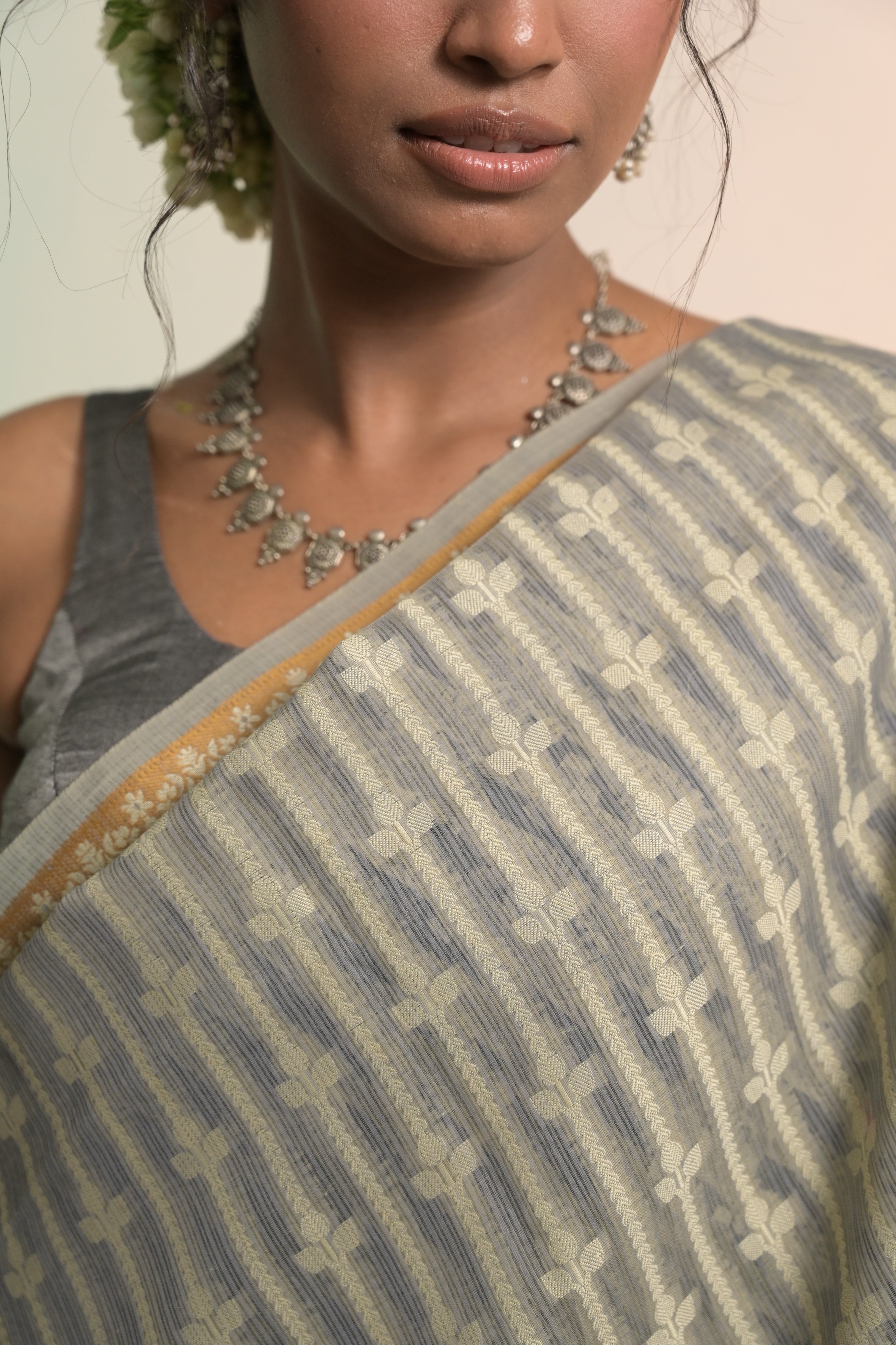 Nivaah I Grey Handloom Cotton Banarasi Saree with Floral Border and striped leave vines