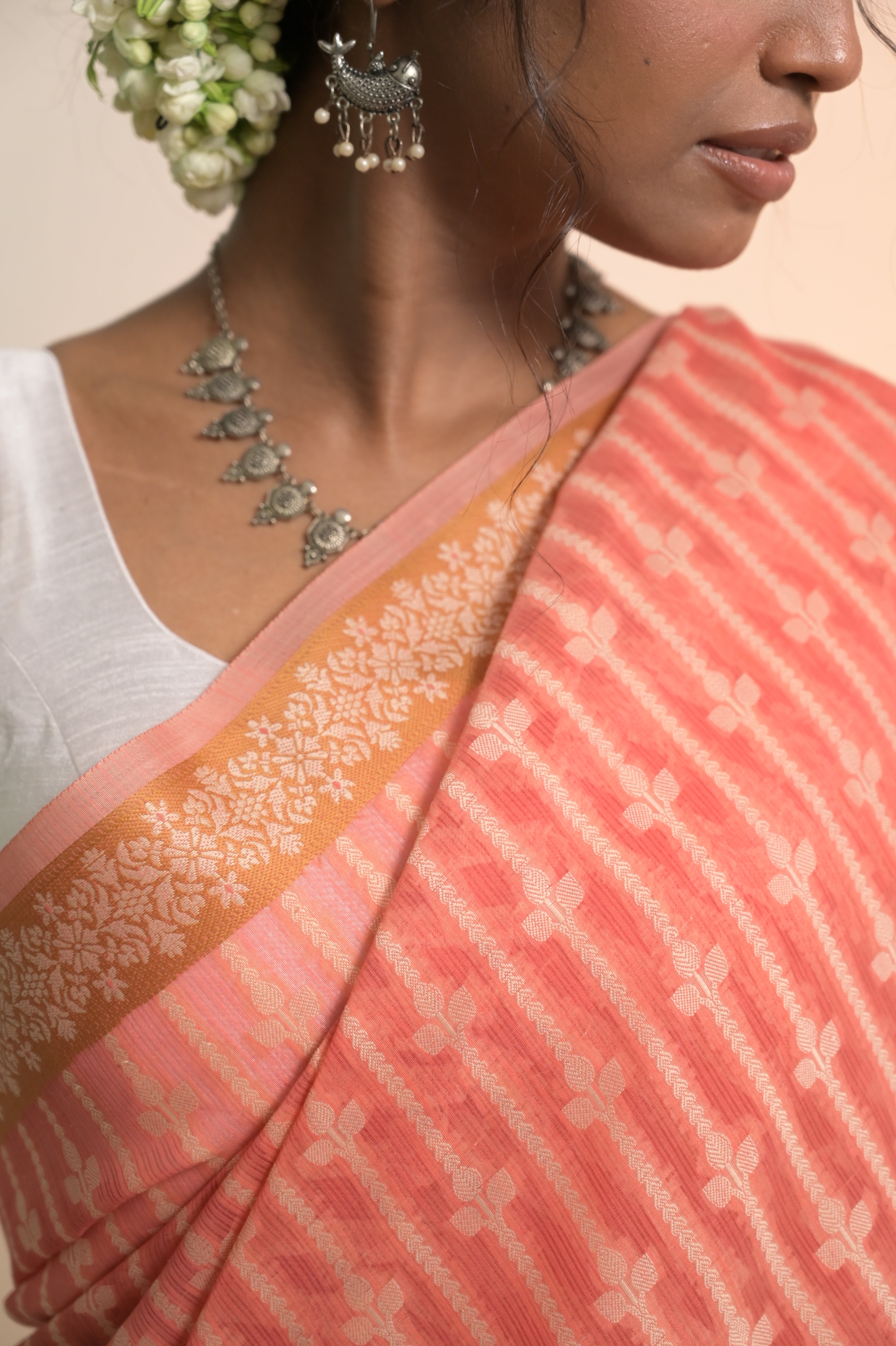 Tattva I Coral Handloom Cotton Banarasi Saree with Floral Border and striped leave vines