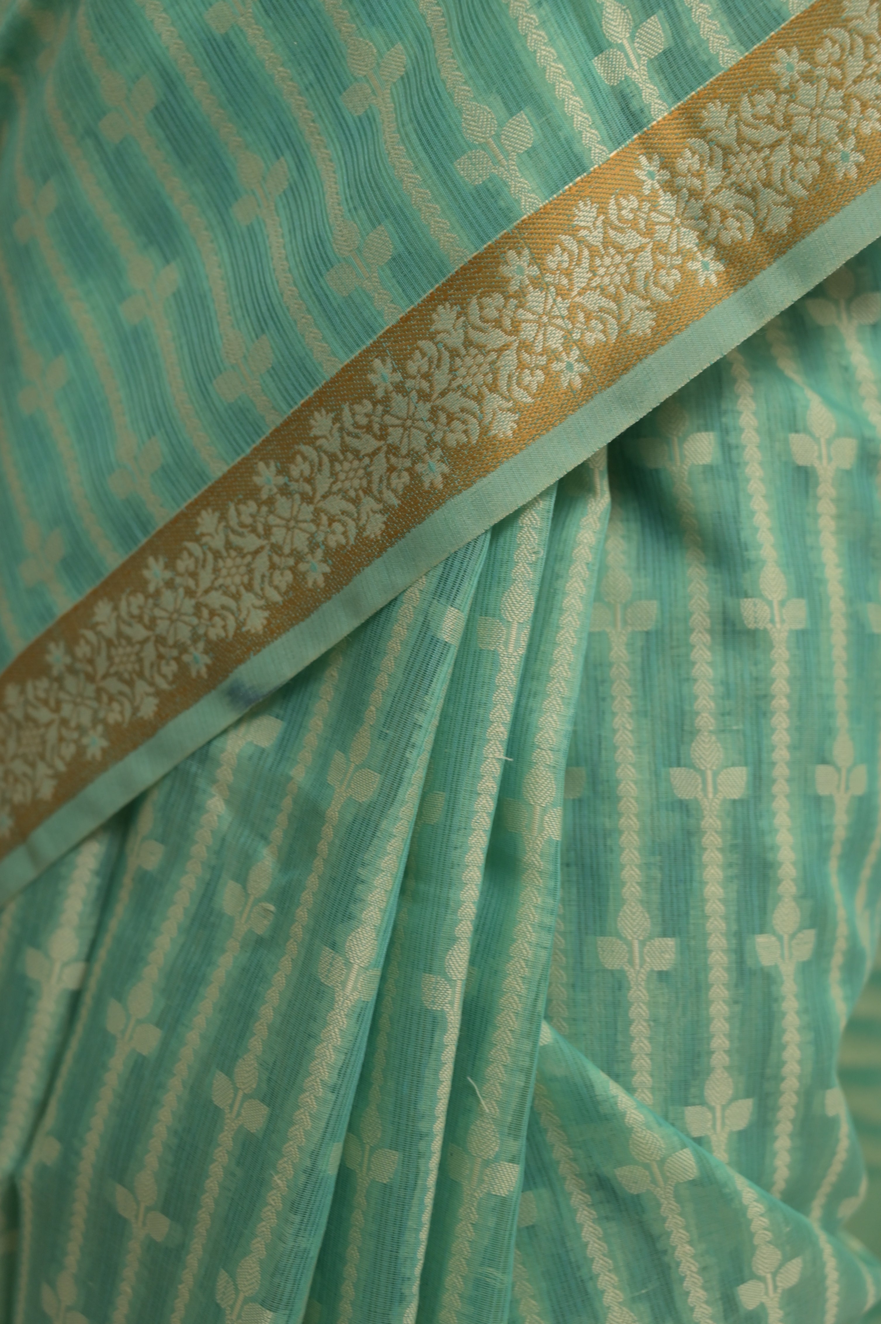 Amaaya I Sea Green Handloom Cotton Banarasi Saree with Floral Border and striped leave vines