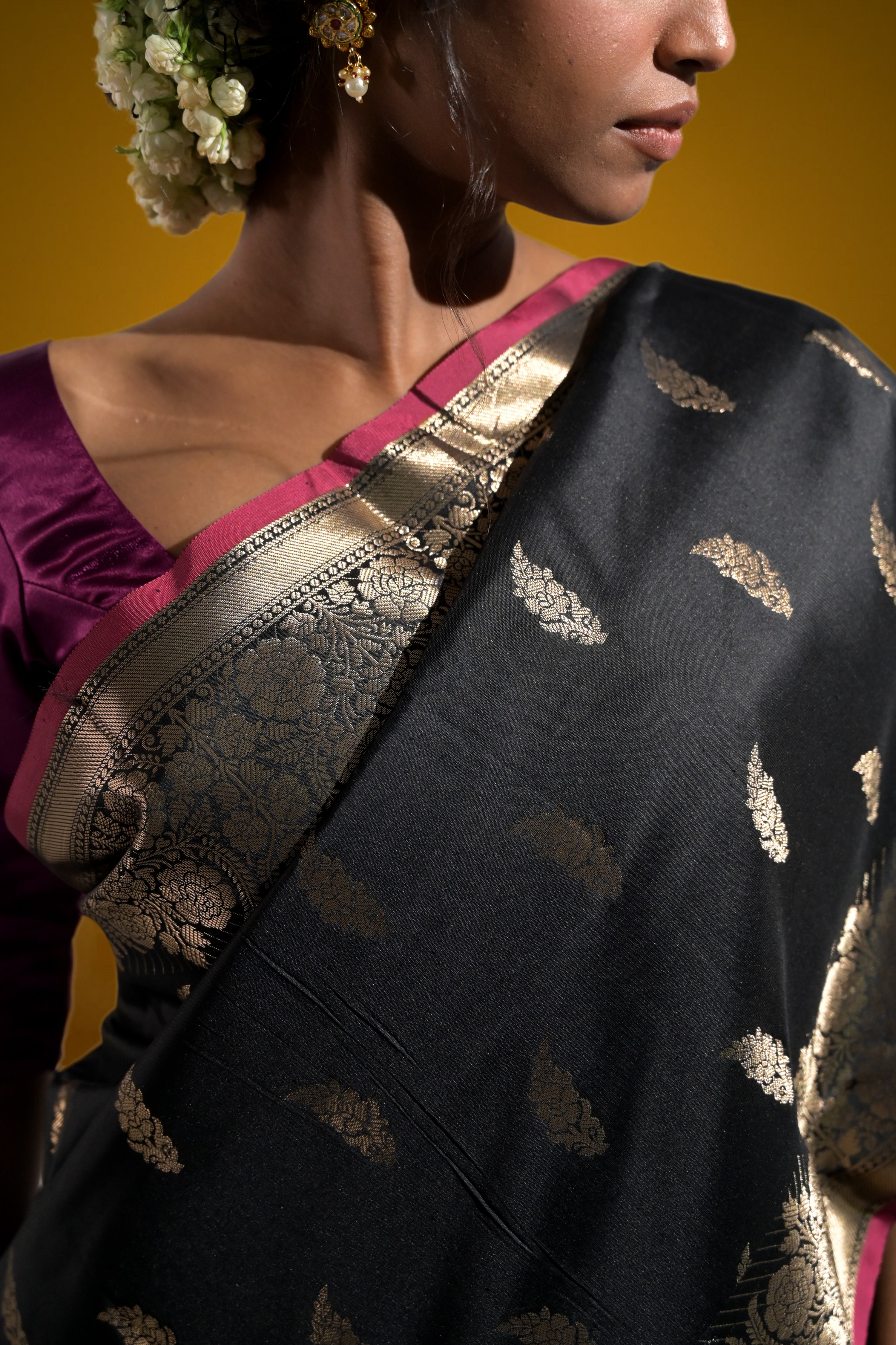 Sargam Sitara I Black Handloom Silk Banarasi Saree with floral zari border and Butis