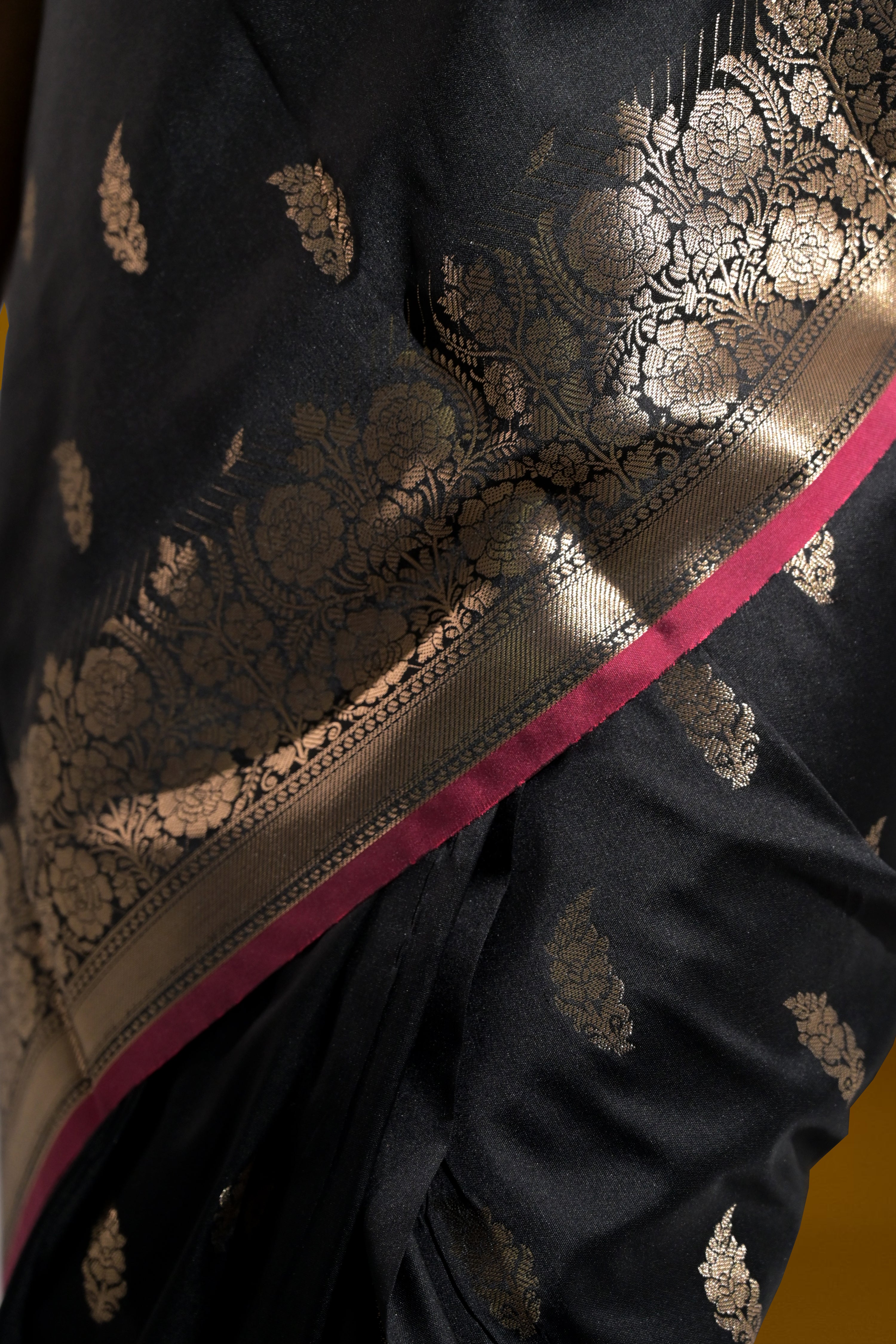 Sargam Sitara I Black Handloom Silk Banarasi Saree with floral zari border and Butis
