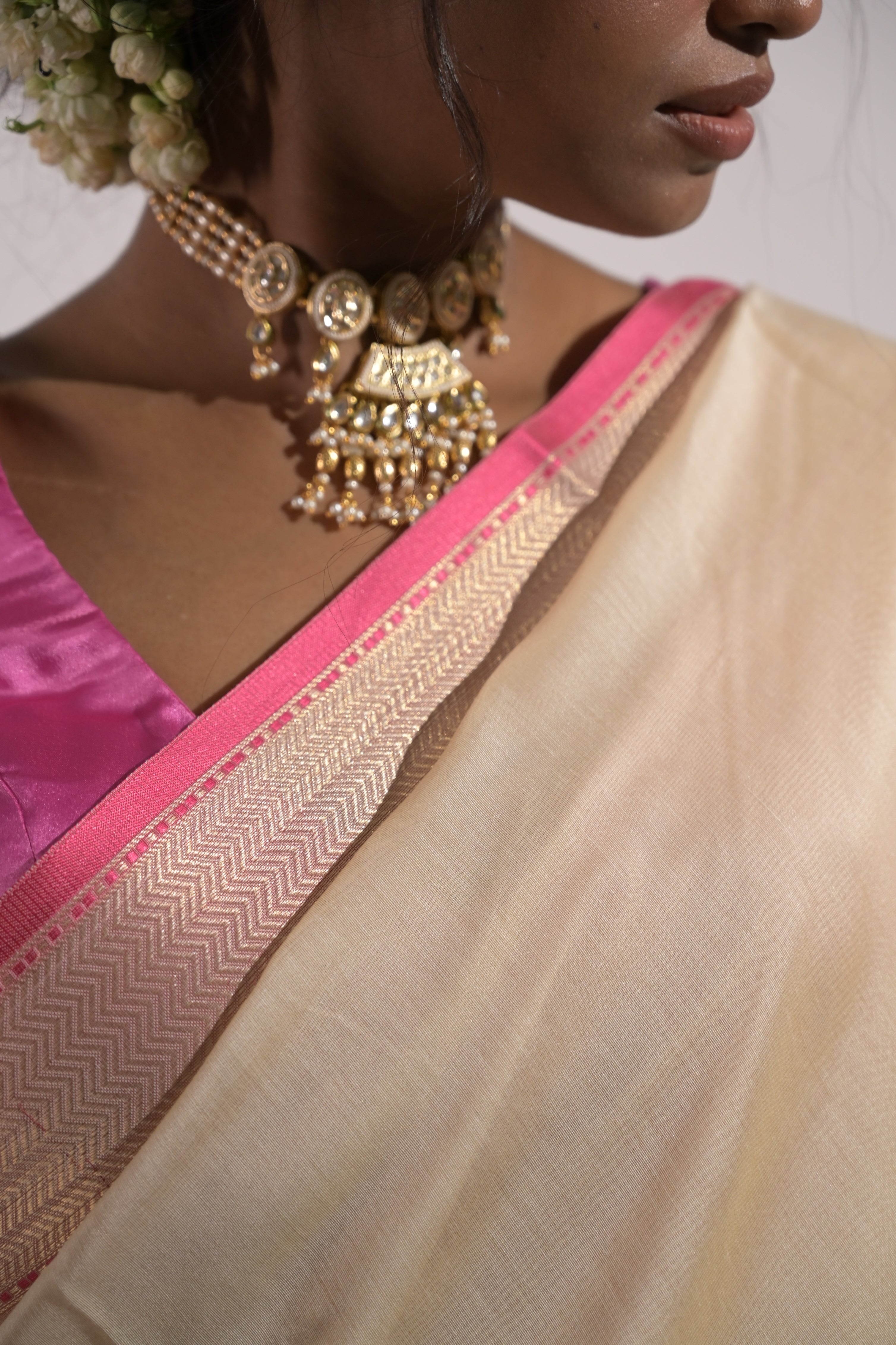 Tanirika I Ivory Handloom Cotton Banarasi Saree with Zari Border and Floral Motifs