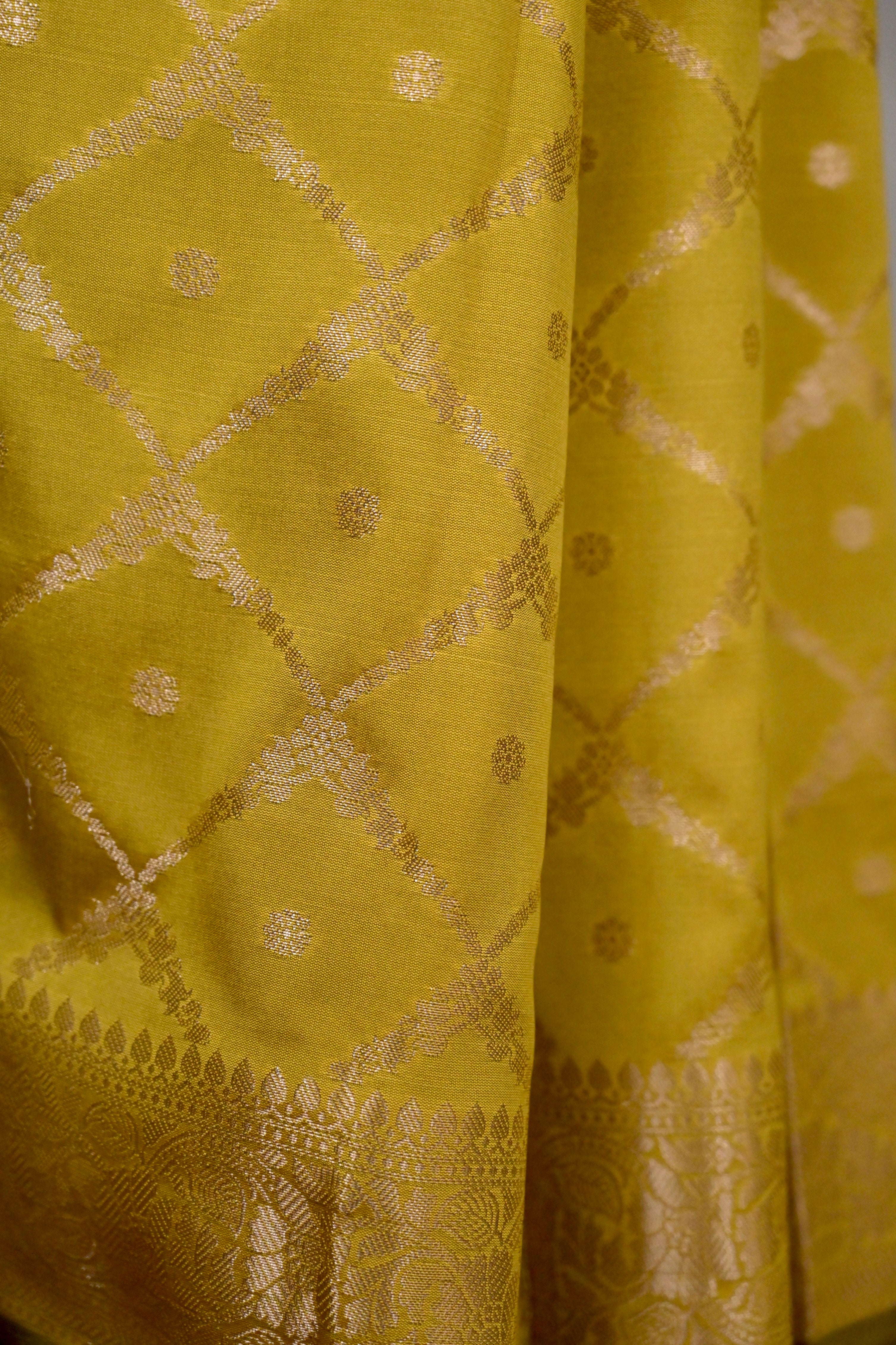 Zarban I mustard Handloom silk Jaal Banarasi Saree with floral Zari Border