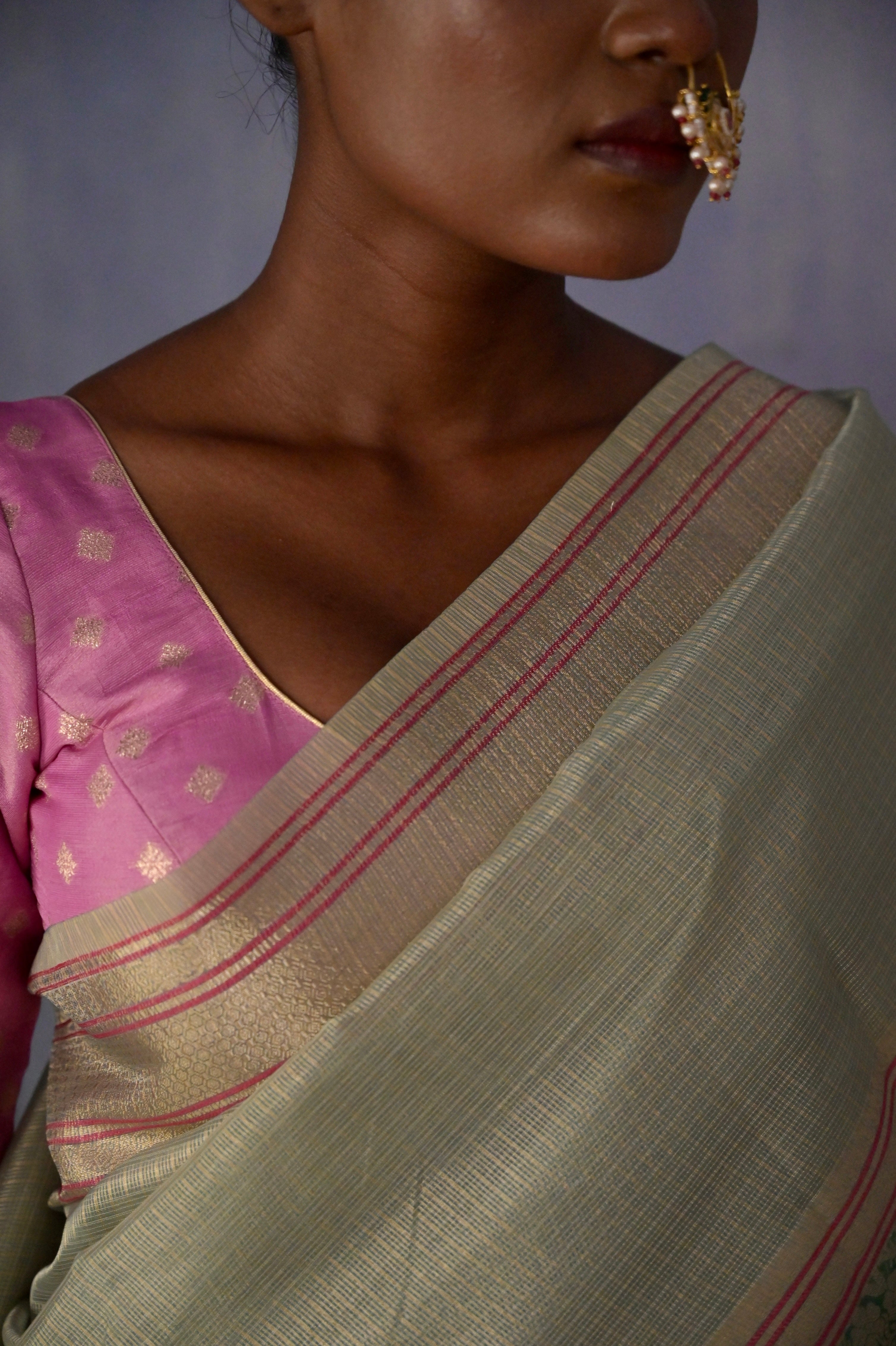 Anandi I Pastel Blue Handloom Kota Banarasi Saree with floral Zari Border