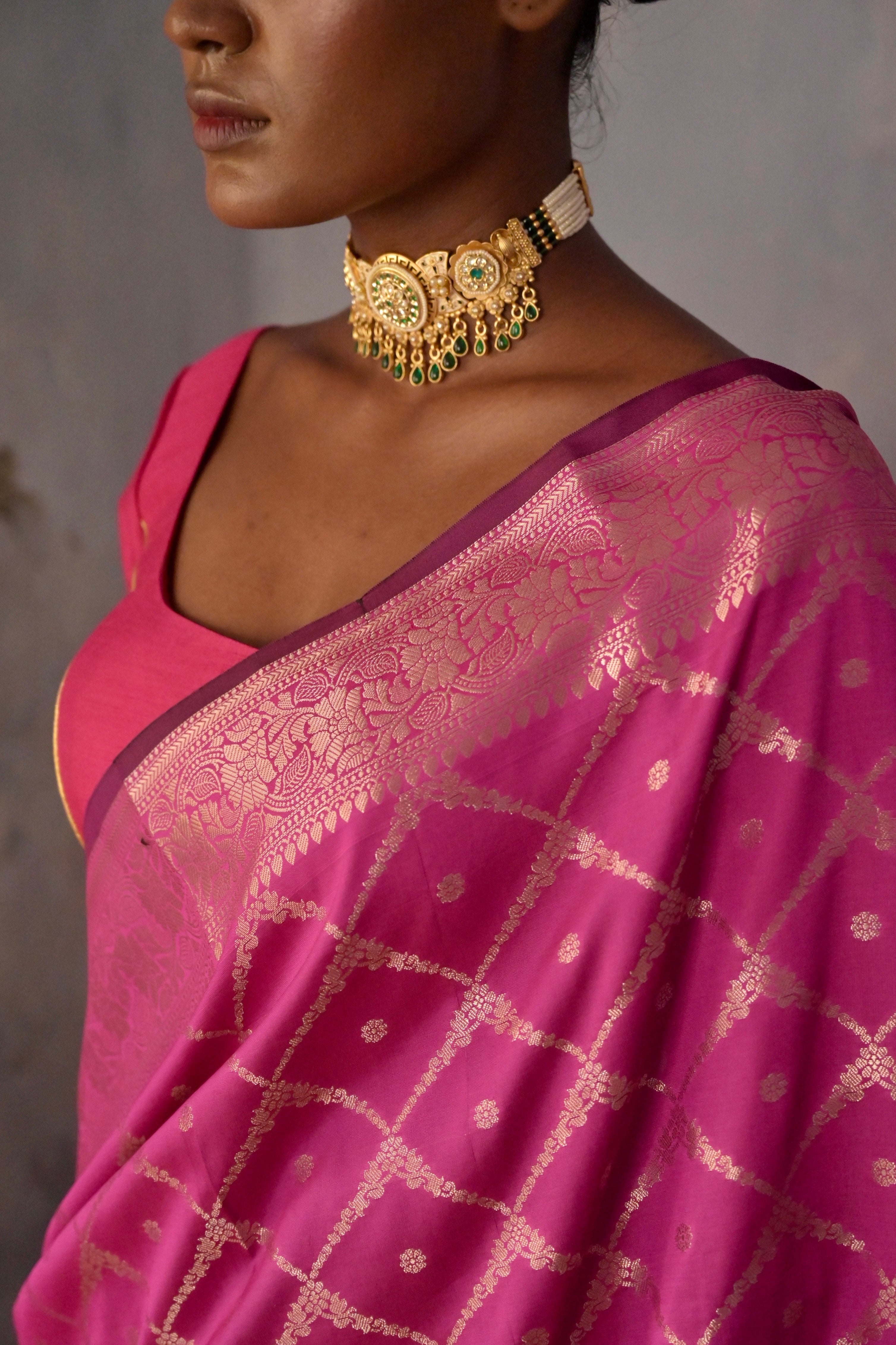 Niyara I Rani pink Handloom silk Jaal Banarasi Saree with floral Zari Border