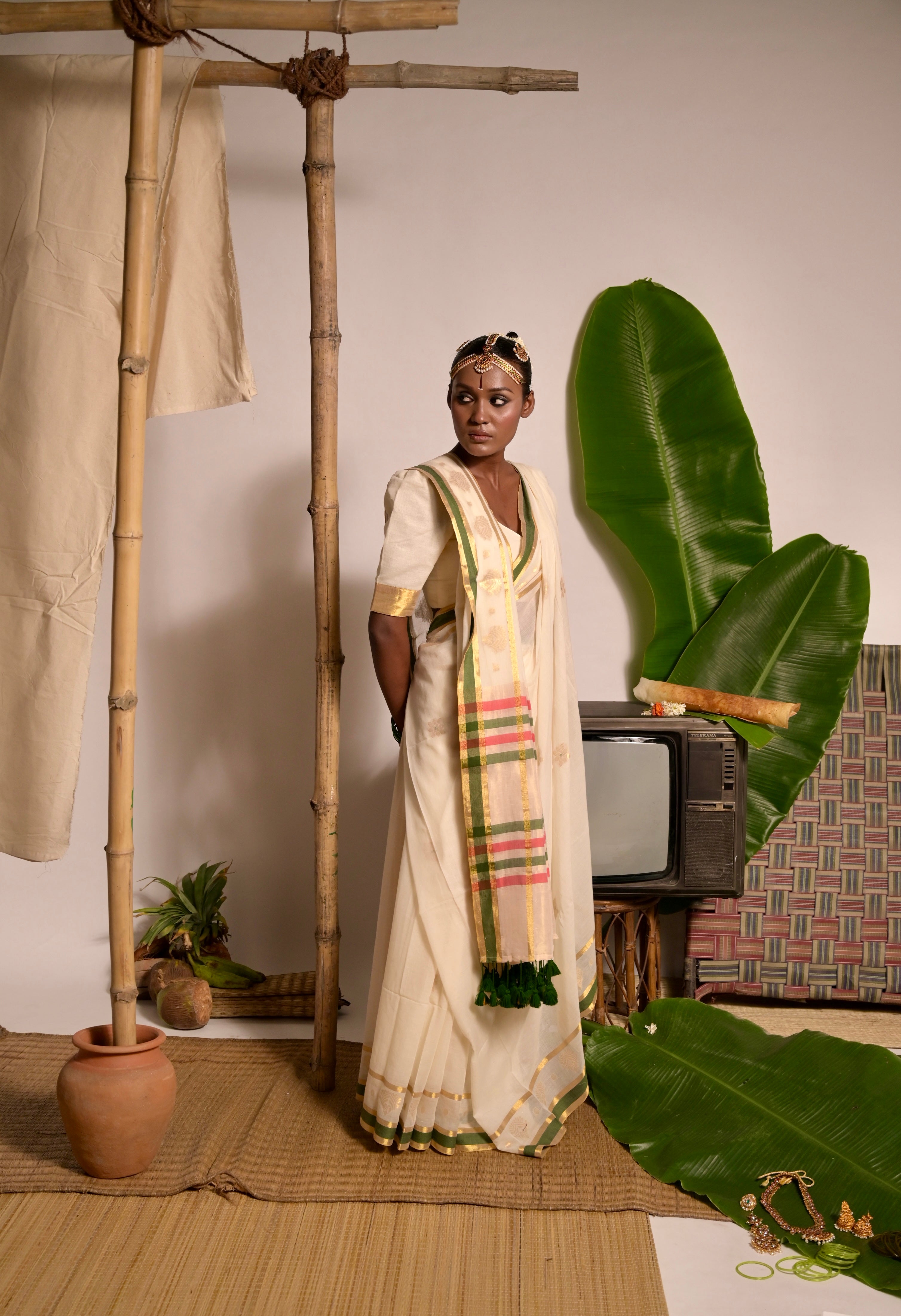 Kathakali I Off white handwoven mul cotton saree with green and zari border