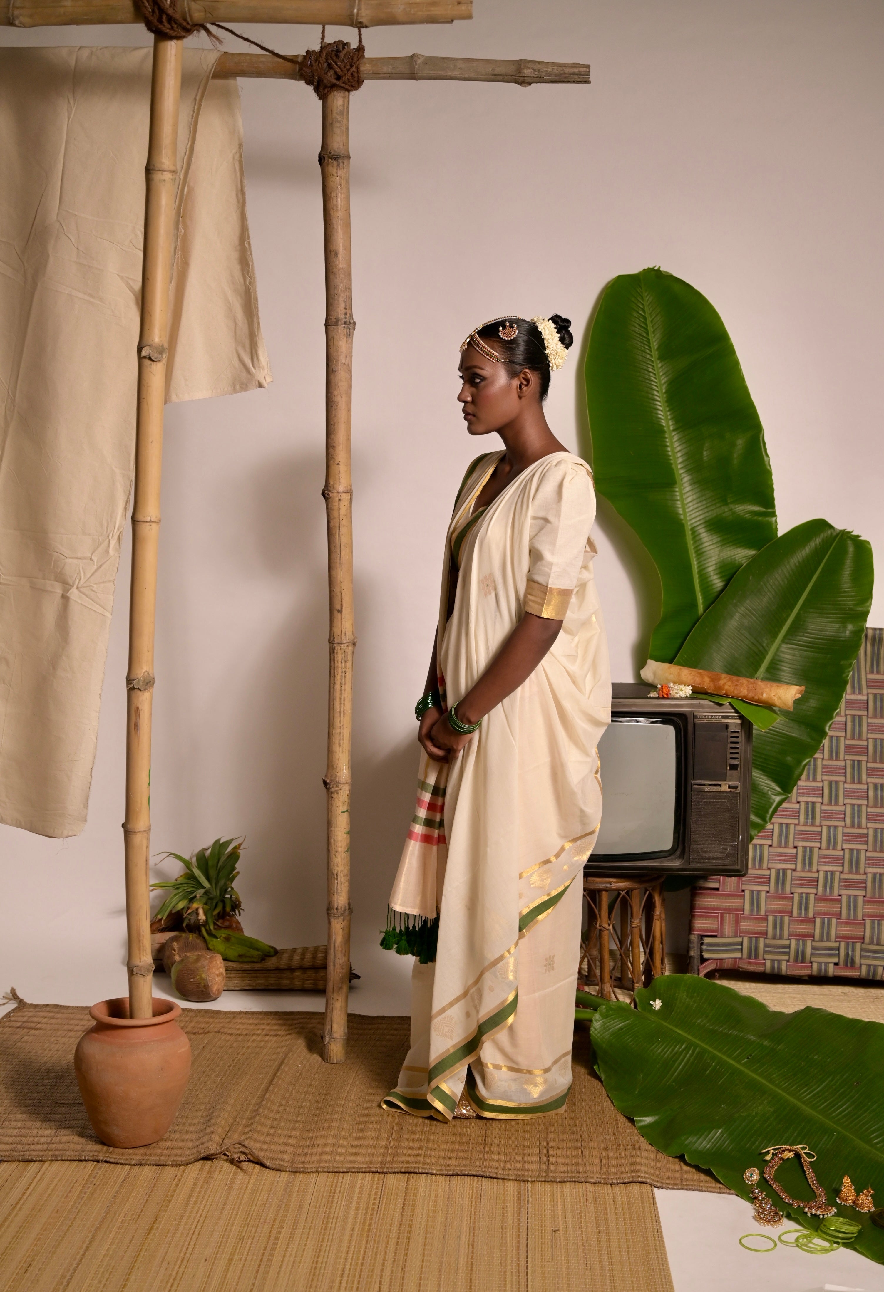 Kathakali I Off white handwoven mul cotton saree with green and zari border