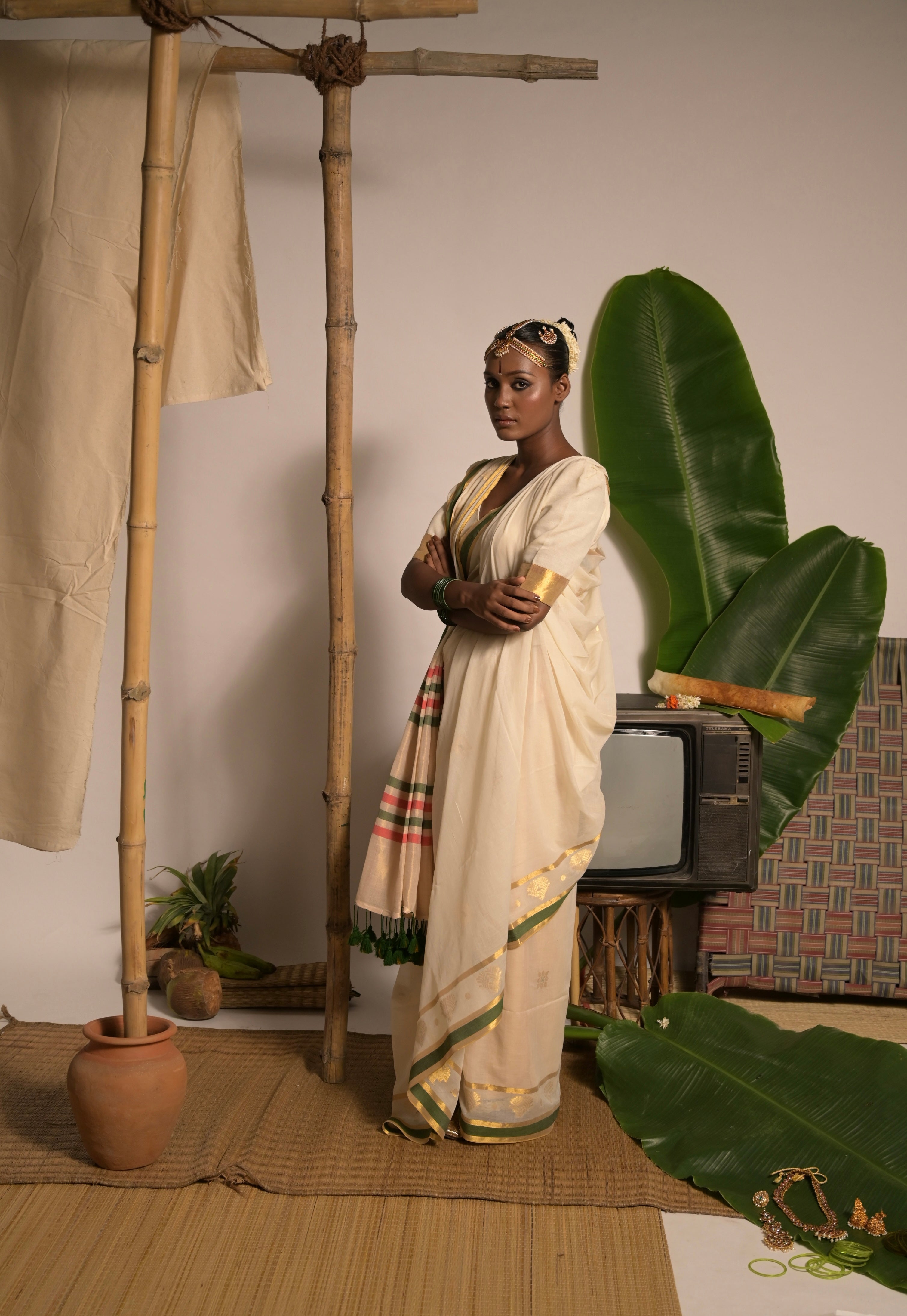 Kathakali I Off white handwoven mul cotton saree with green and zari border