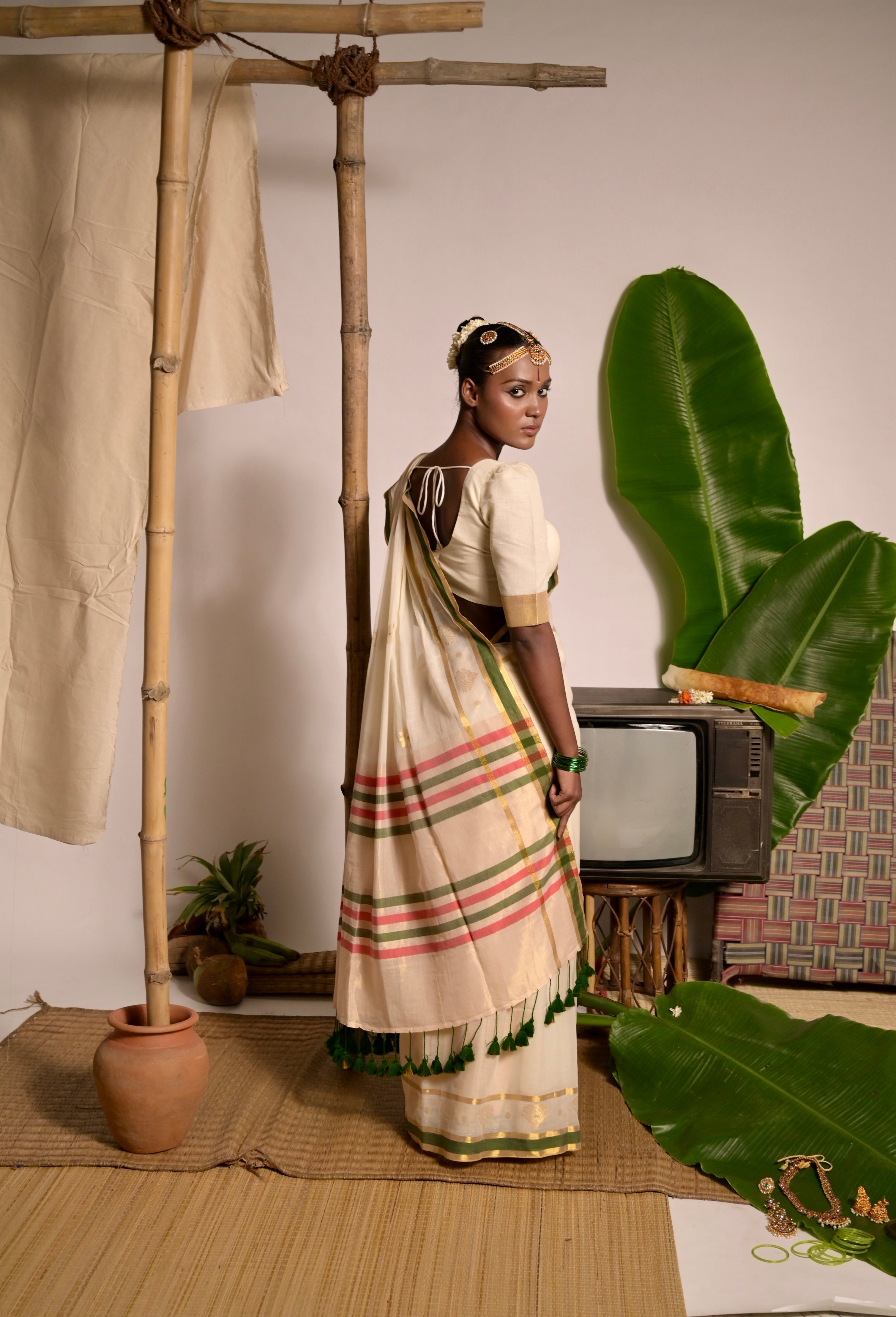 Kathakali I Off white handwoven mul cotton saree with green and zari border
