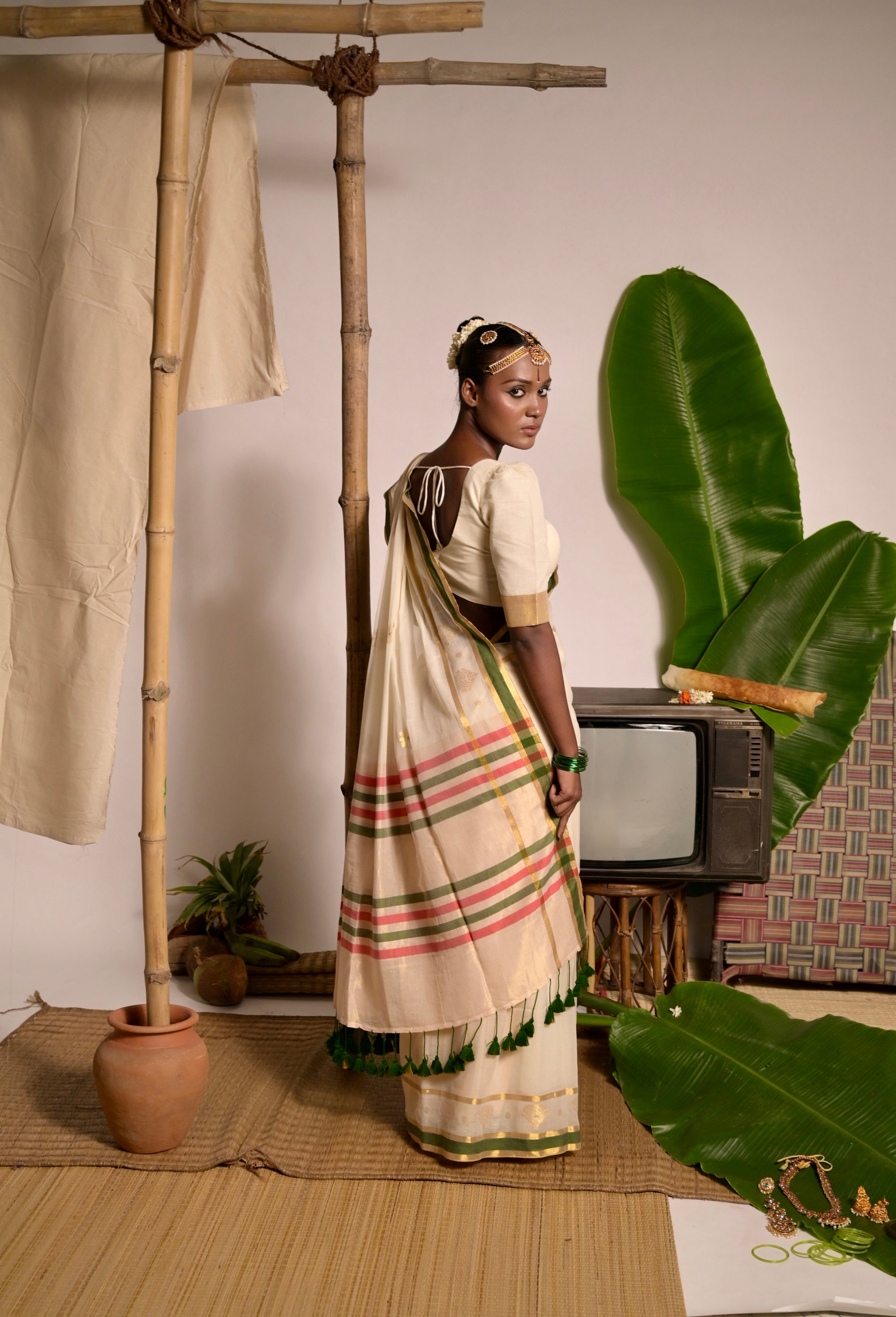 Kathakali I Off white handwoven mul cotton saree with green and zari border