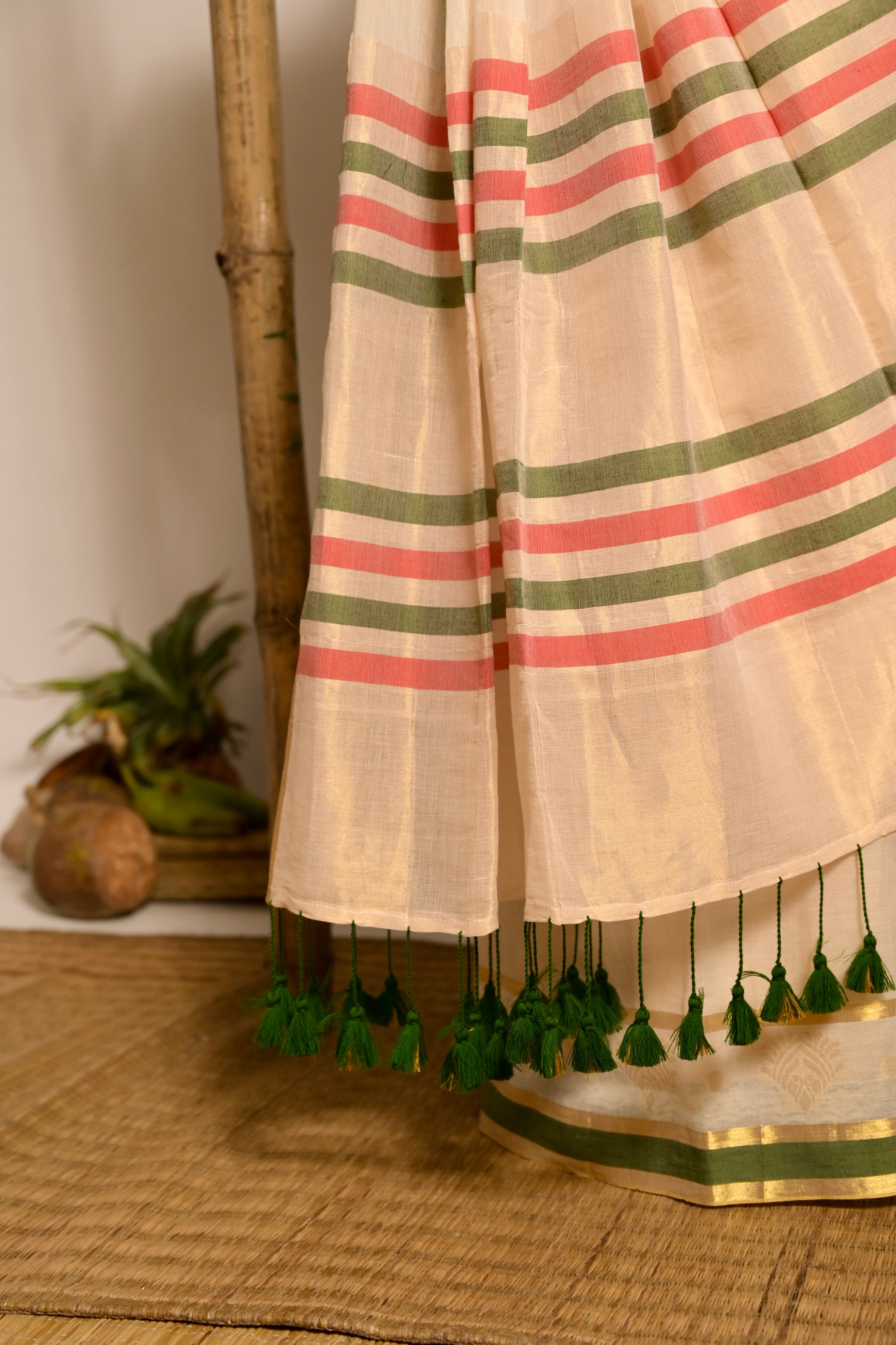 Kathakali I Off white handwoven mul cotton saree with green and zari border