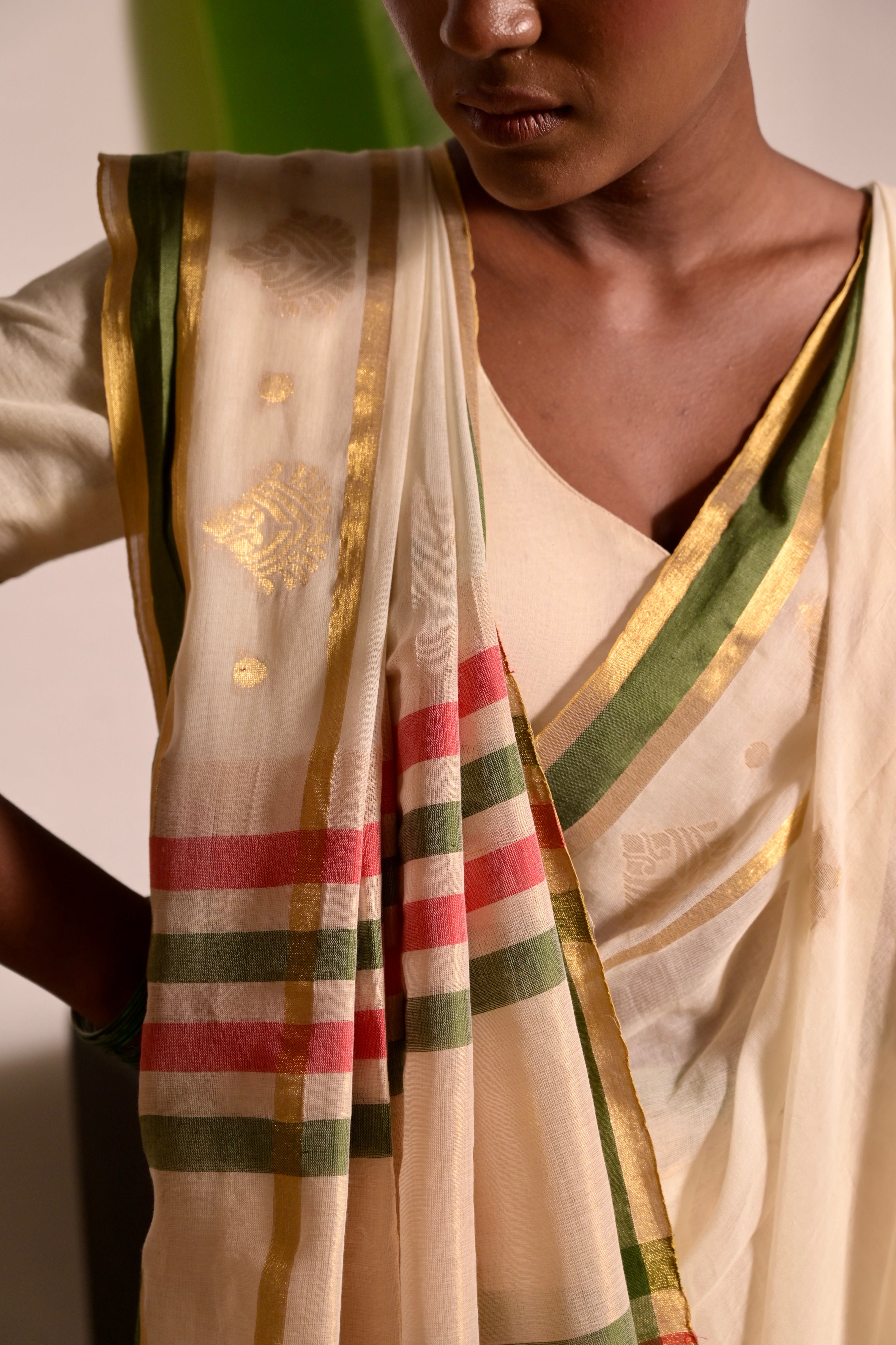 Kathakali I Off white handwoven mul cotton saree with green and zari border
