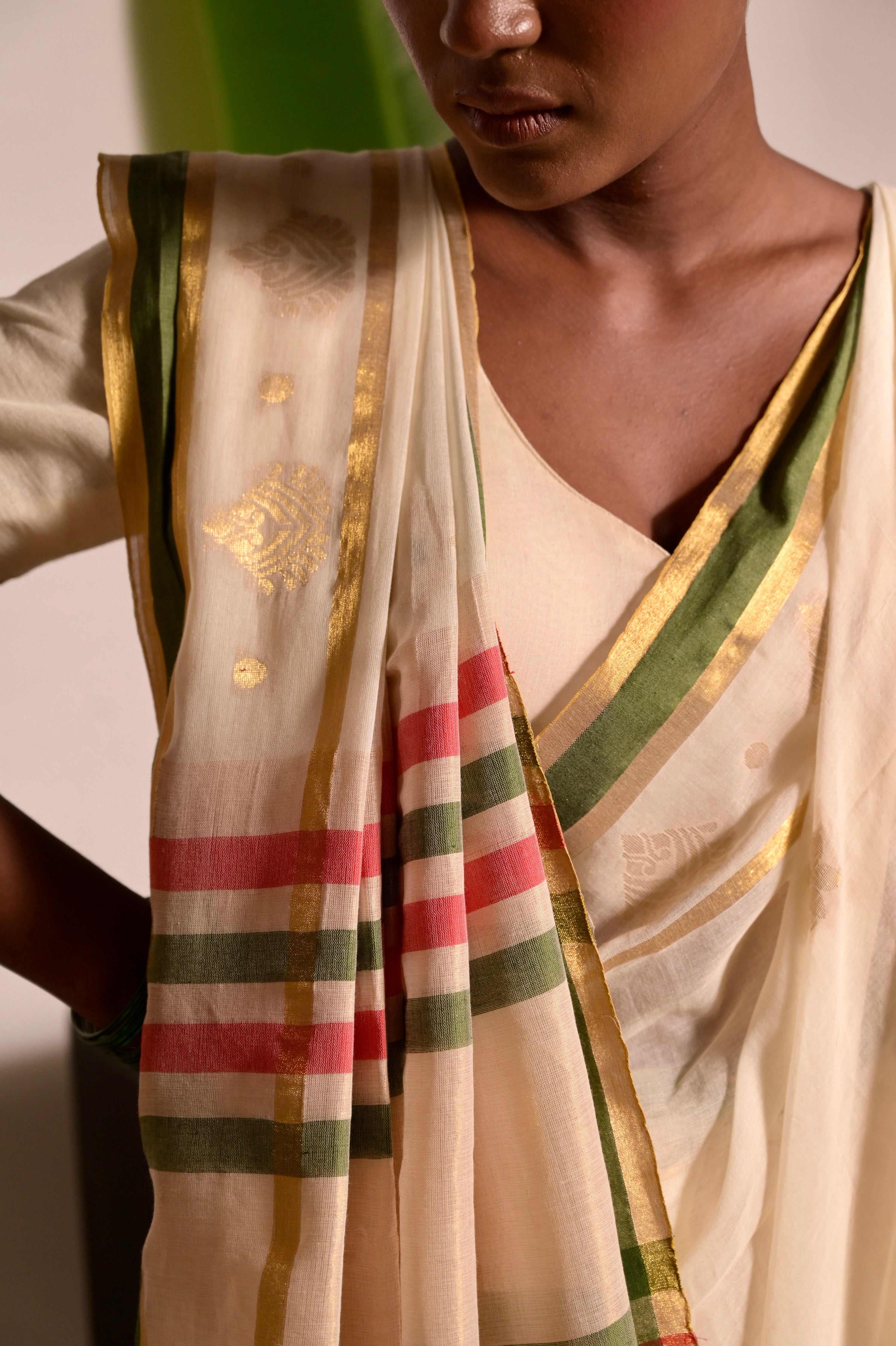 Kathakali I Off white handwoven mul cotton saree with green and zari border