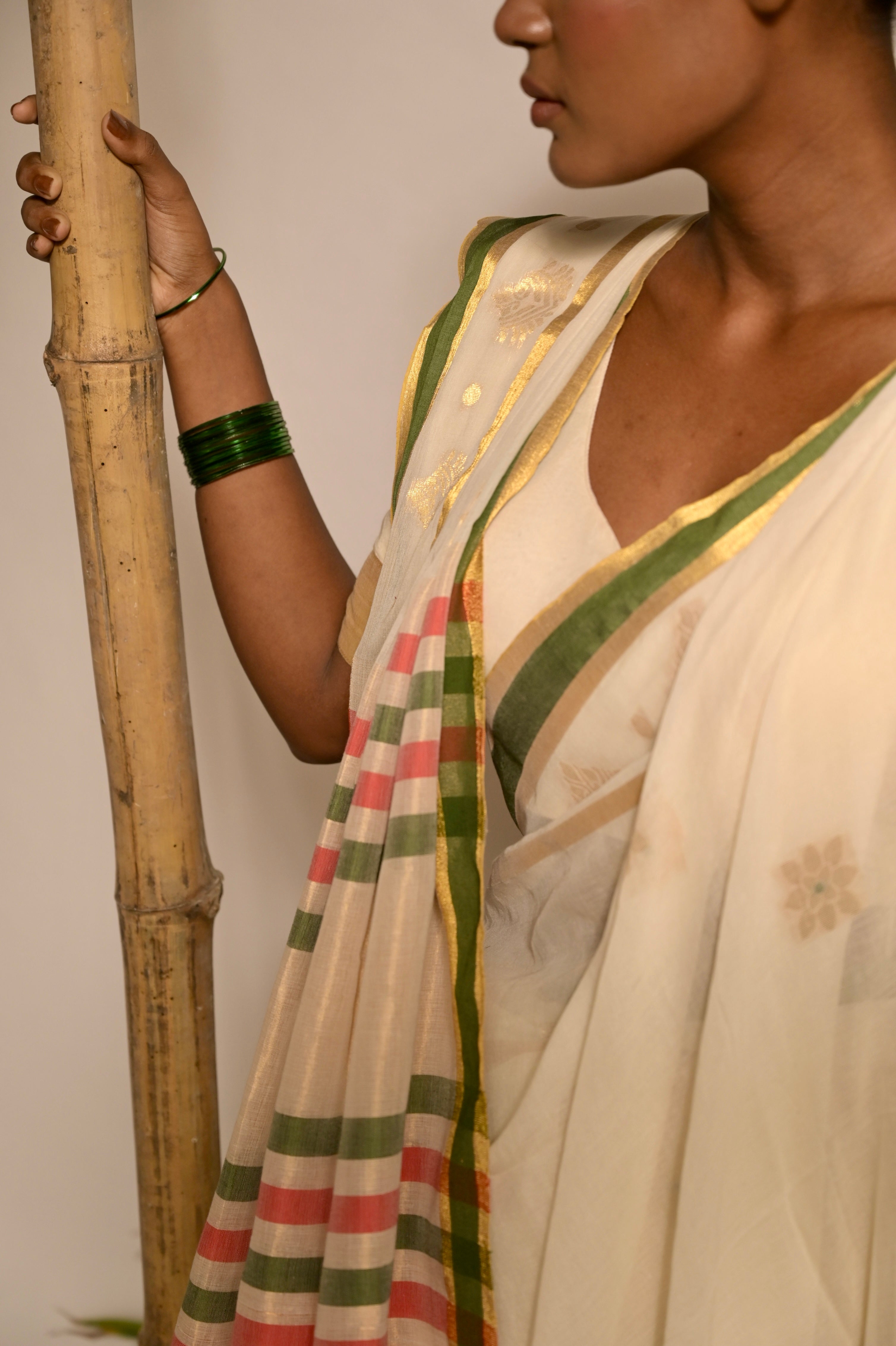 Kathakali I Off white handwoven mul cotton saree with green and zari border