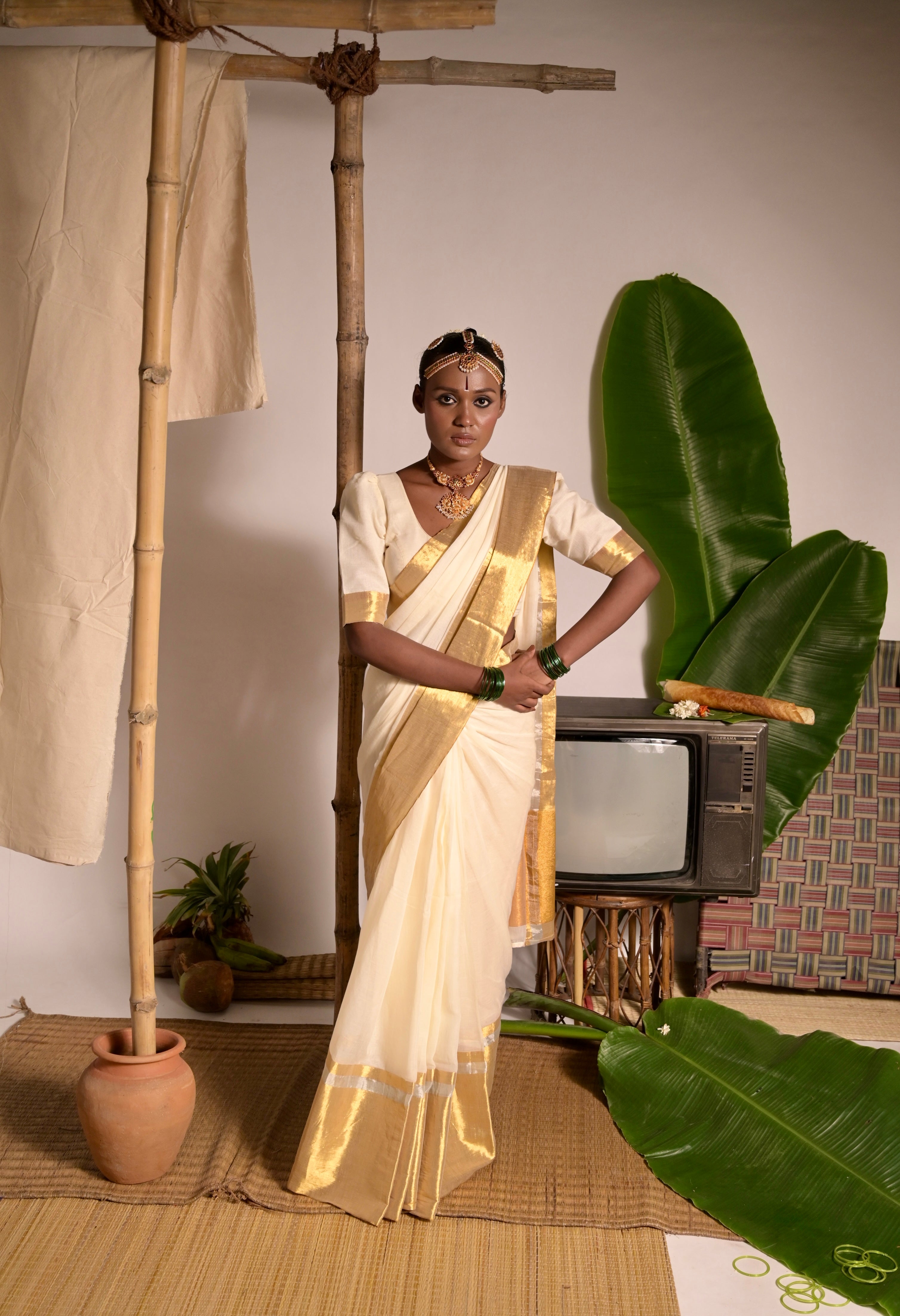Swarnamaya I Off white mul cotton handwoven saree with golden border