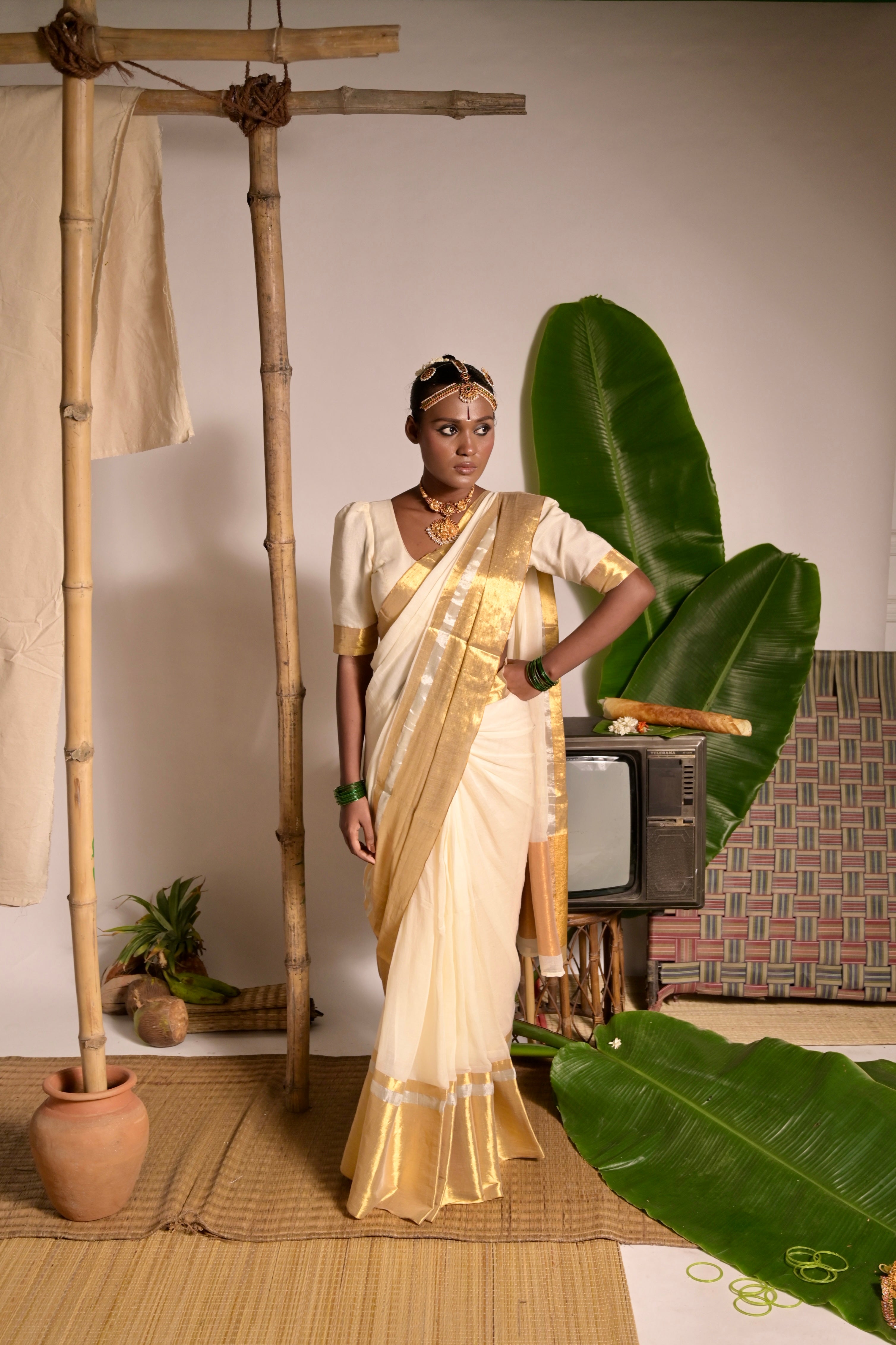 Swarnamaya I Off white mul cotton handwoven saree with golden border