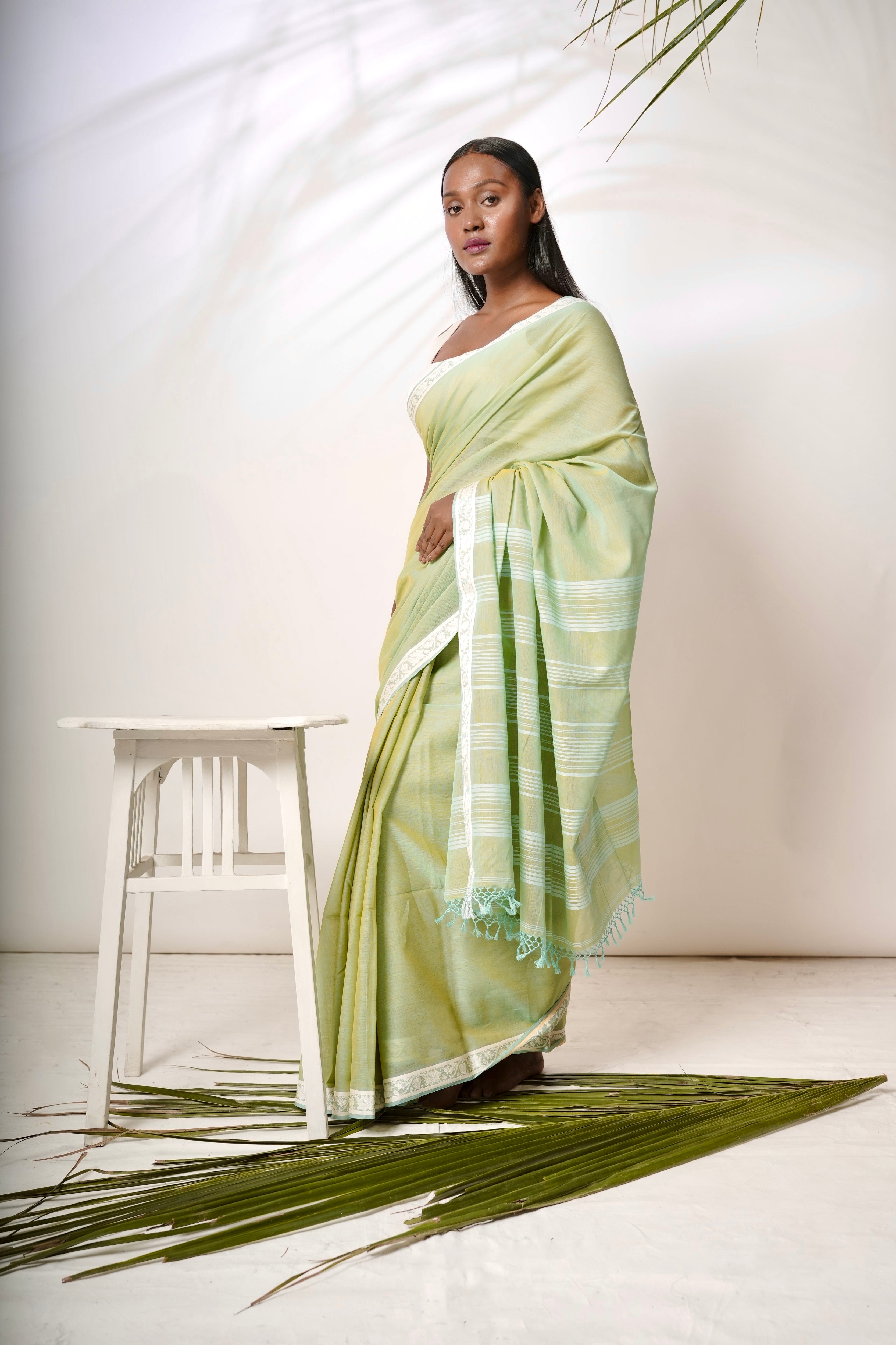Luminous I  Light green cotton saree with white border