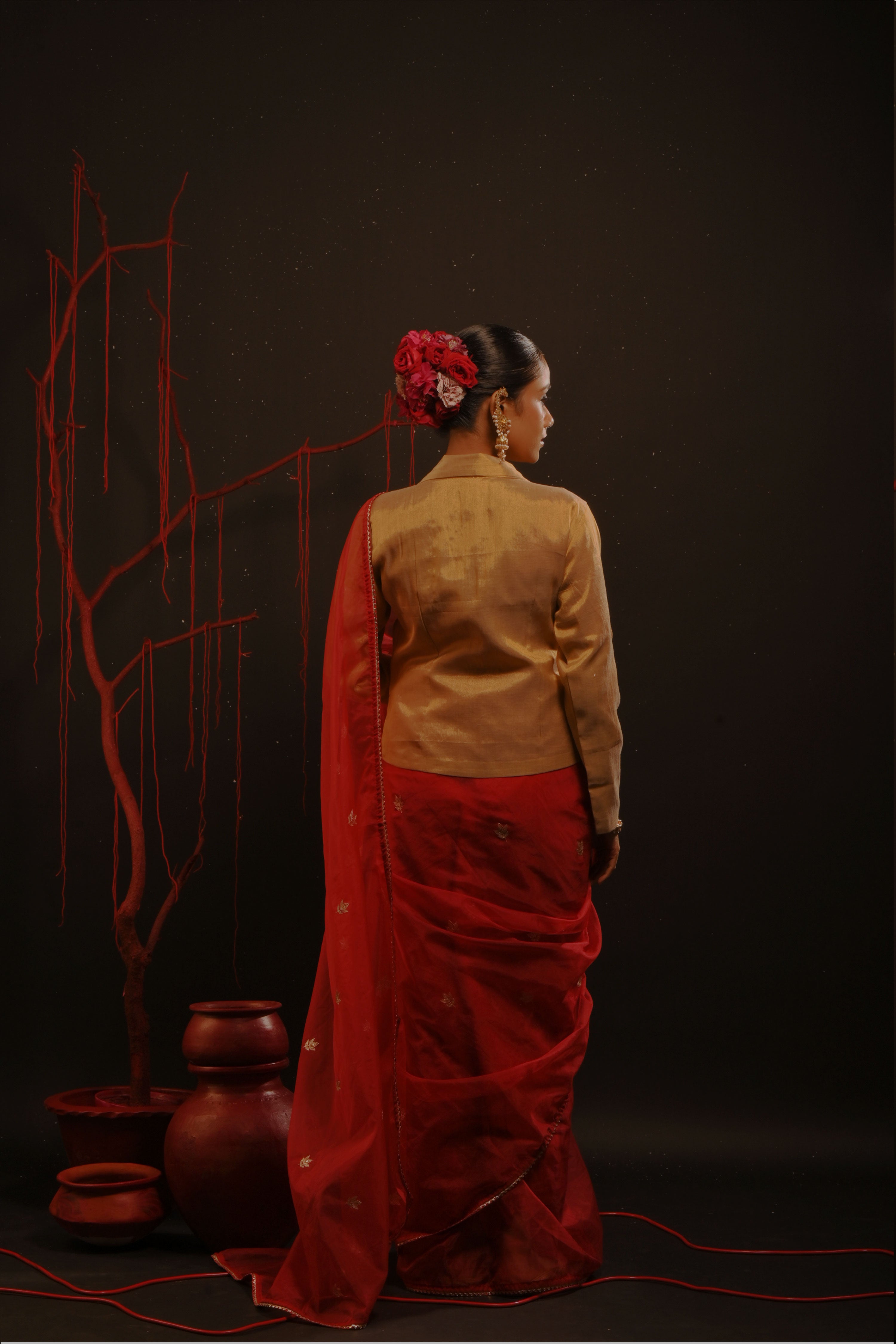 Mihira I Red organza saree paired with red chinon blouse and Tissue jacket