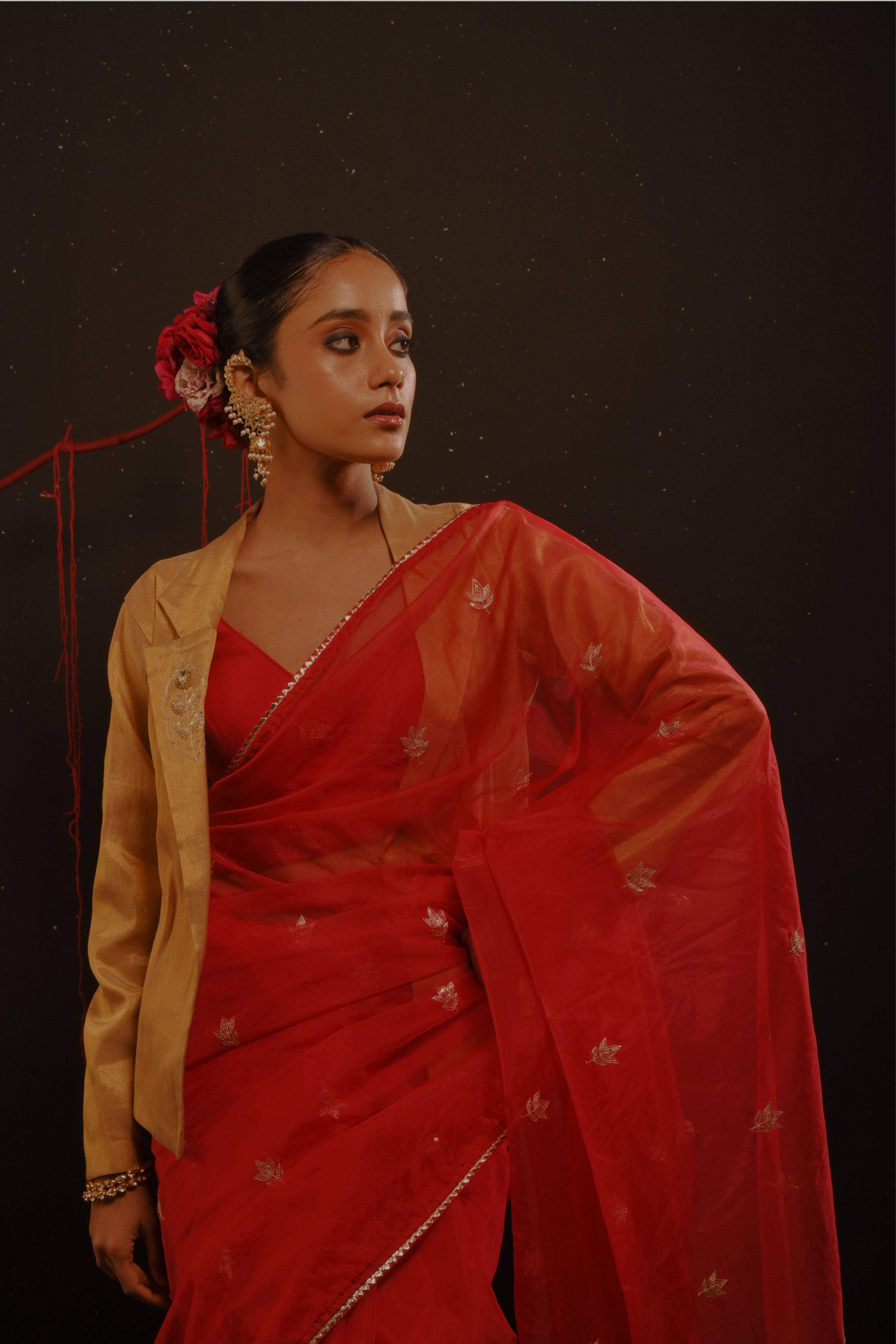 Mihira I Red organza saree paired with red chinon blouse and Tissue jacket