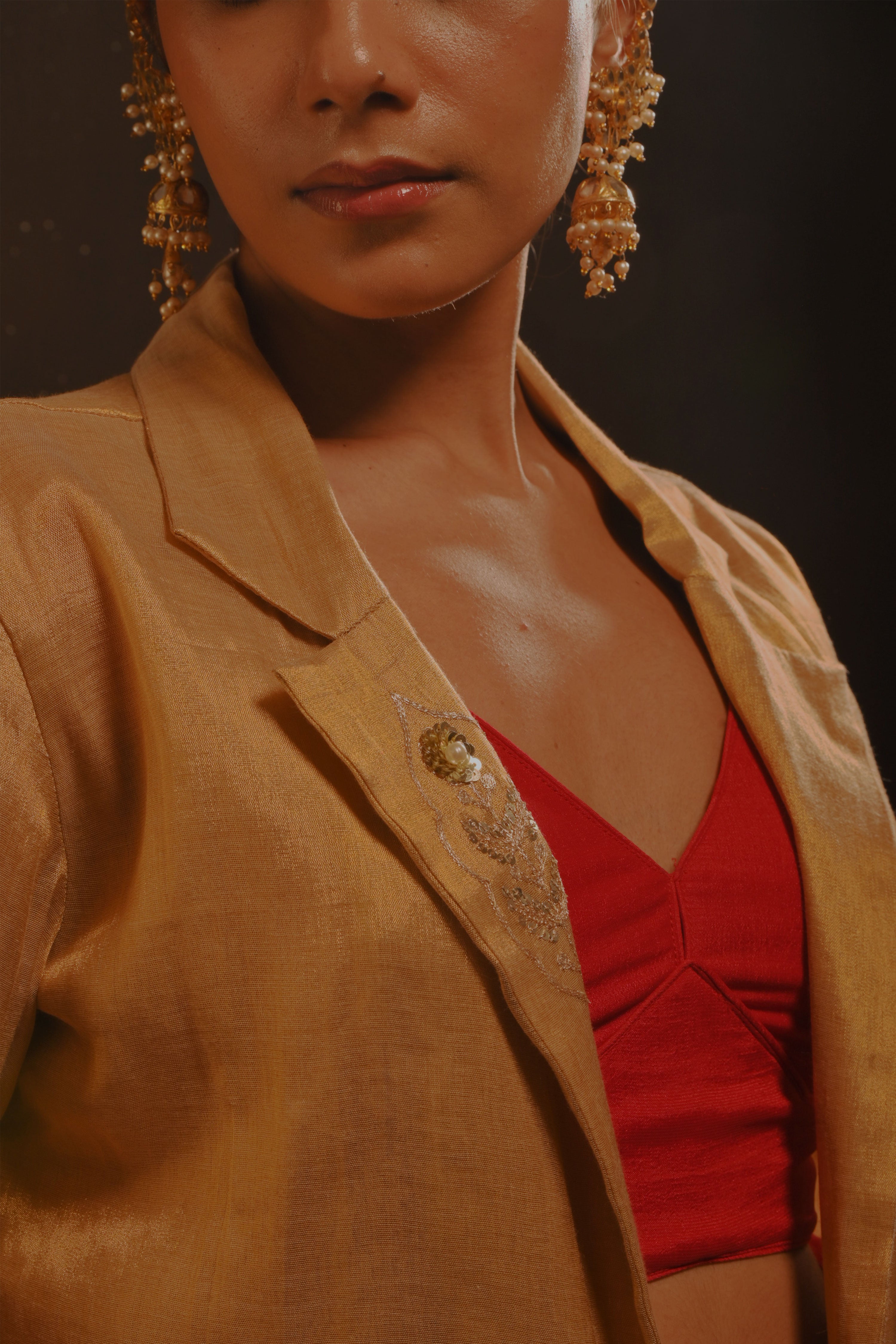 Mihira I Red organza saree paired with red chinon blouse and Tissue jacket