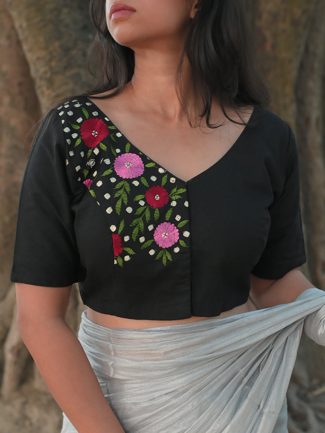 Black blouse with minimalist embroidery