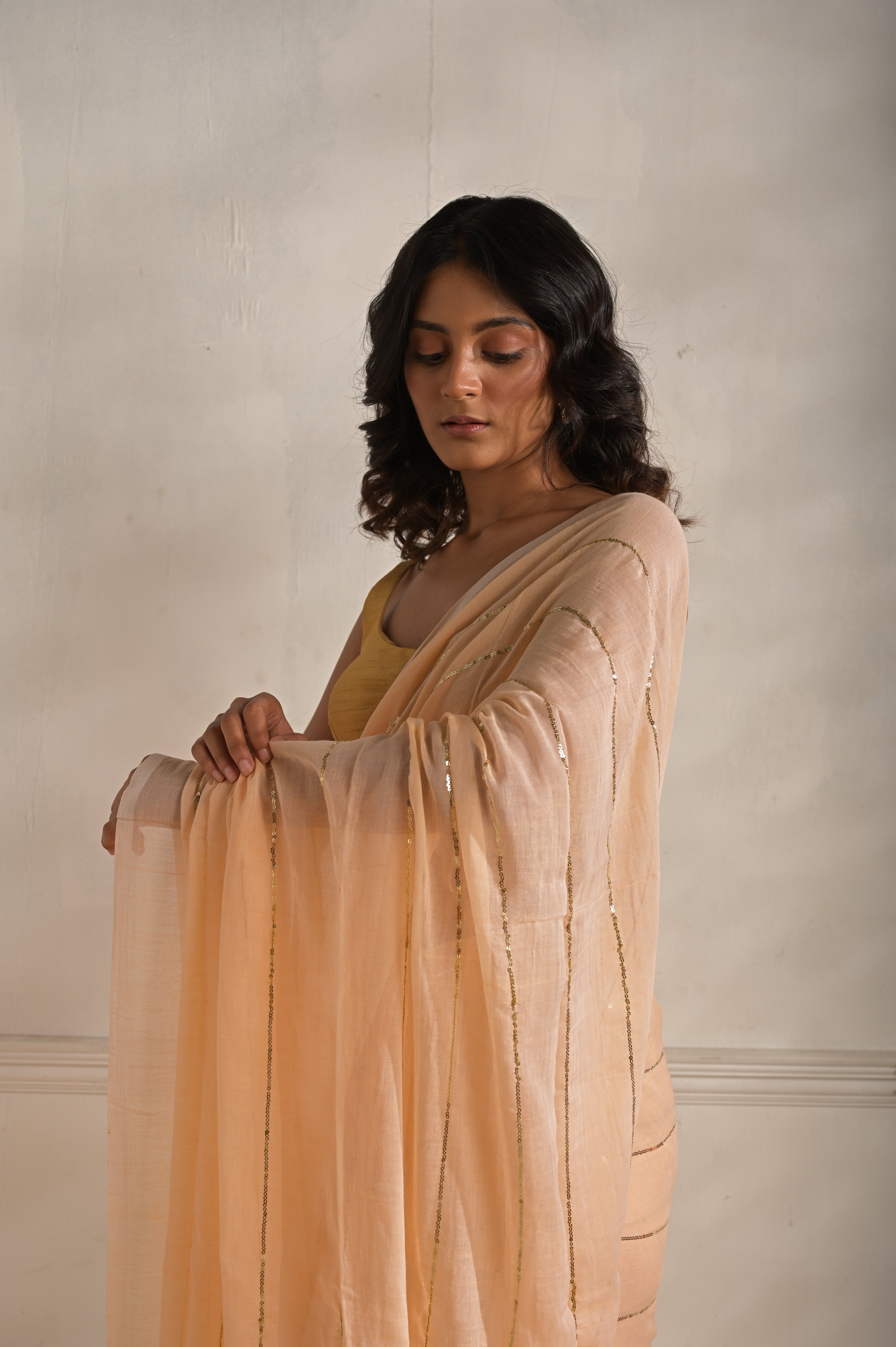 Roshni | Peach handloom mul cotton saree with sequined lines