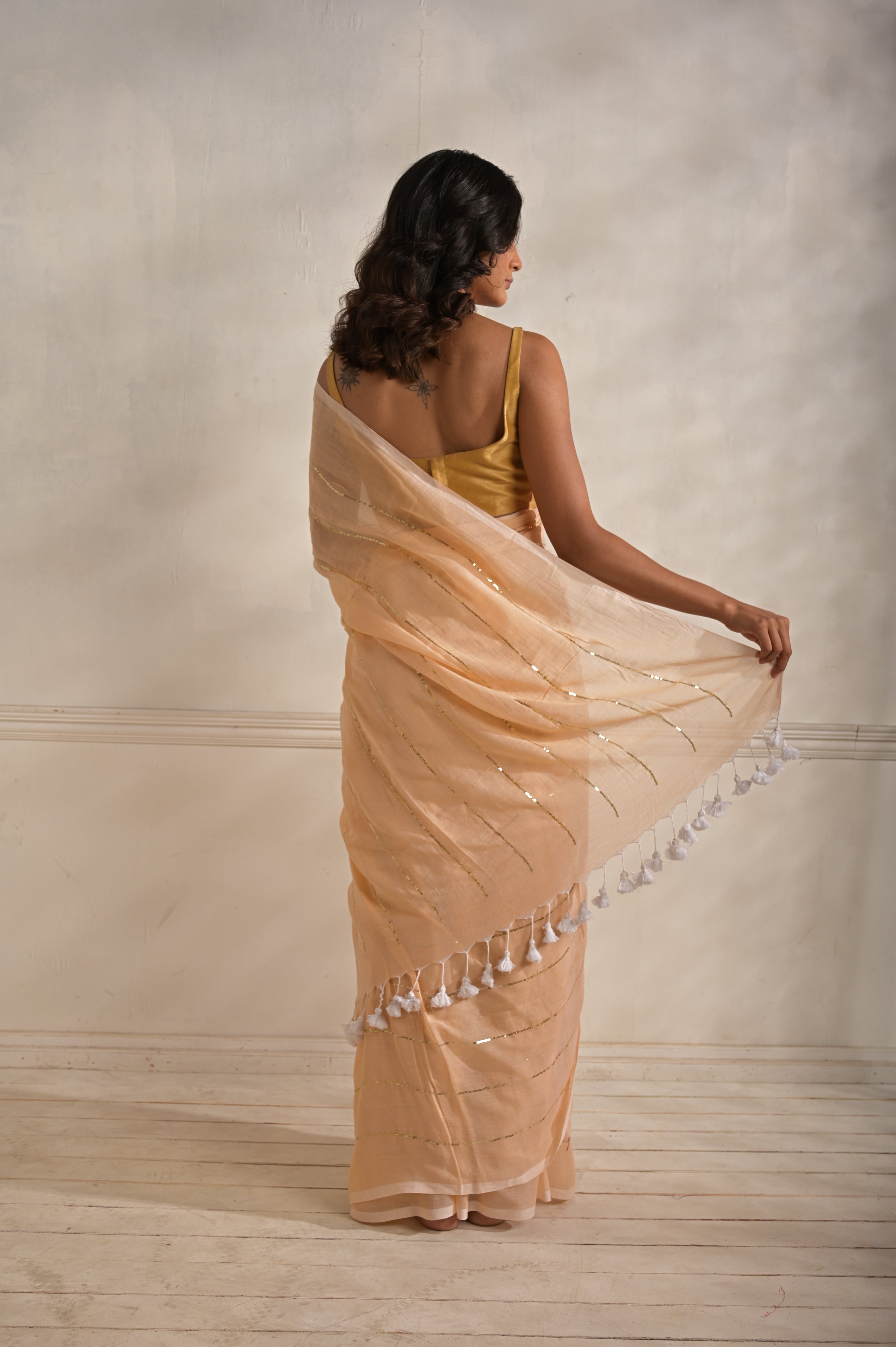 Roshni | Peach handloom mul cotton saree with sequined lines