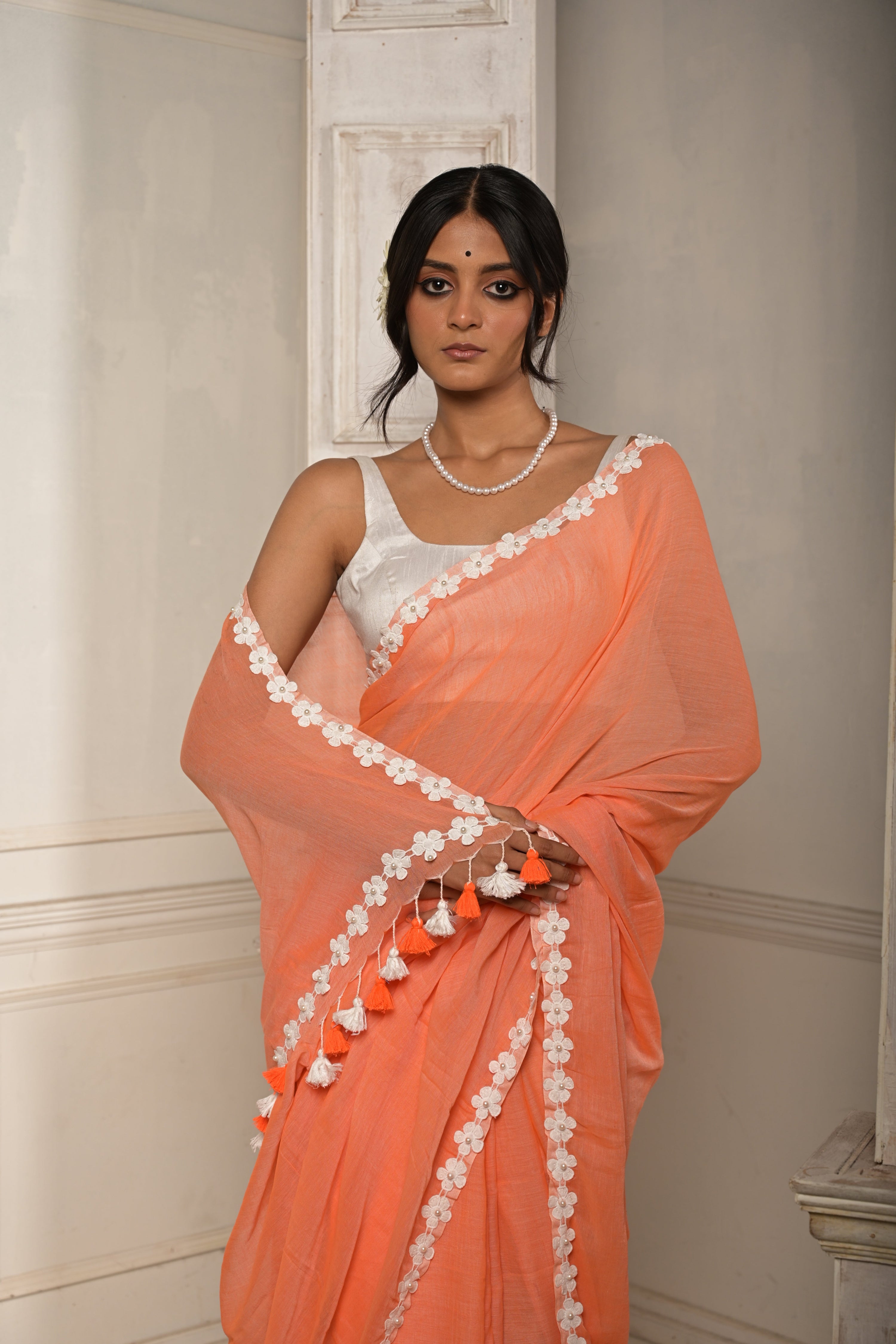 Surbhi shaam | Peach cotton saree with stitched lace floral embroidered border