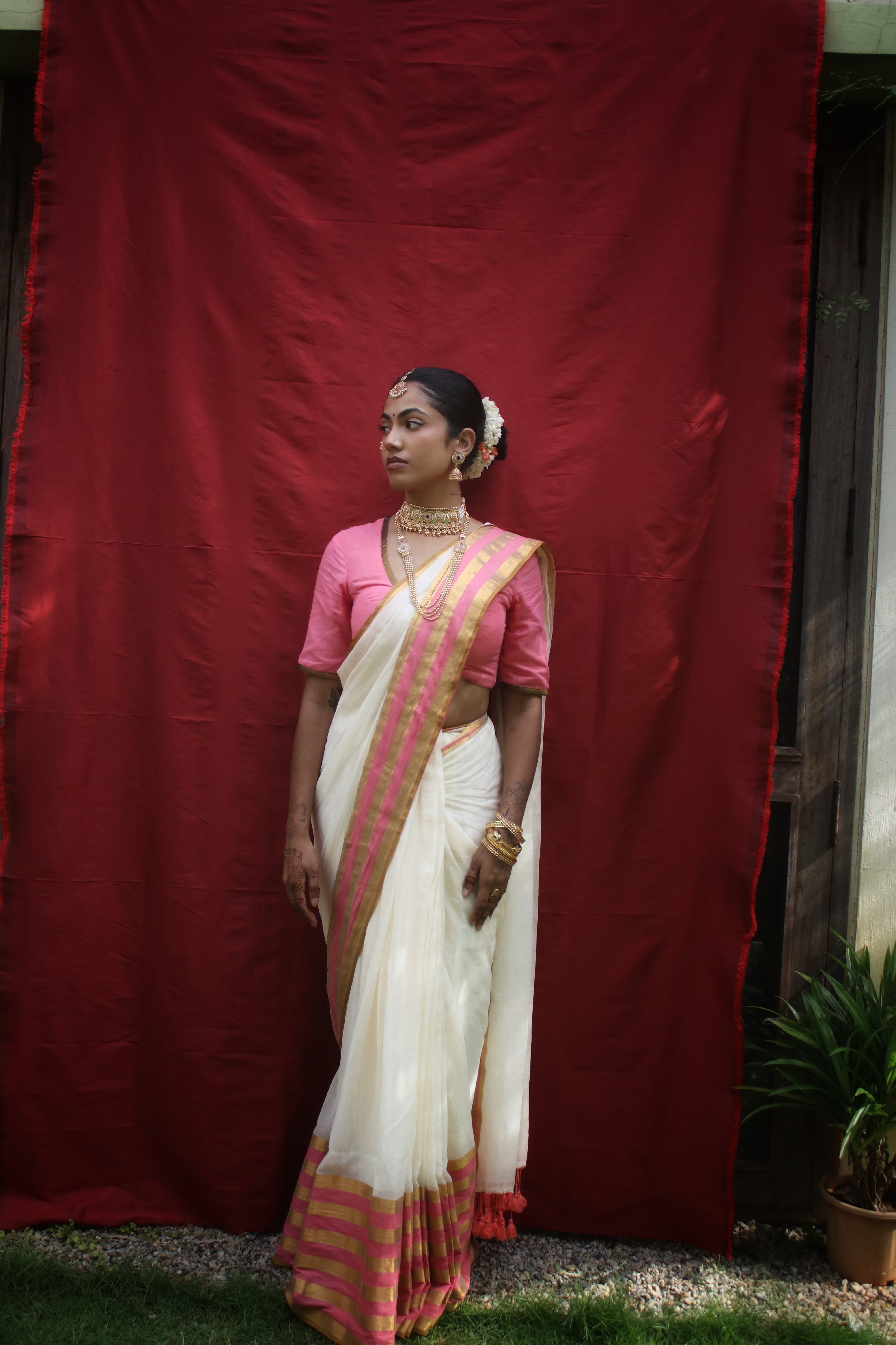 Chandramaya I Cream White Cotton Saree with Pink and Golden Striped Border