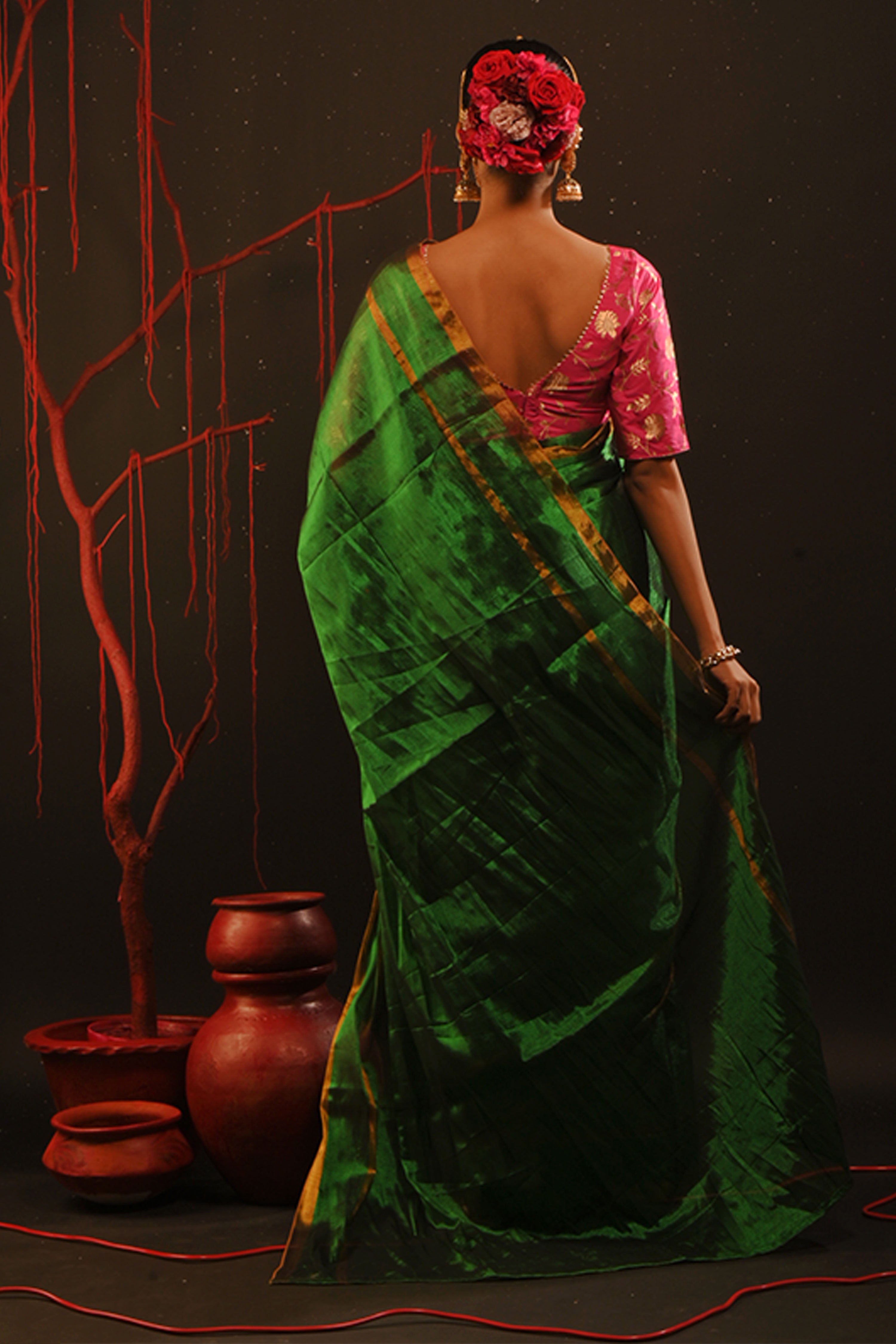 Chitrani I Green handwoven tissue saree with gold striped border